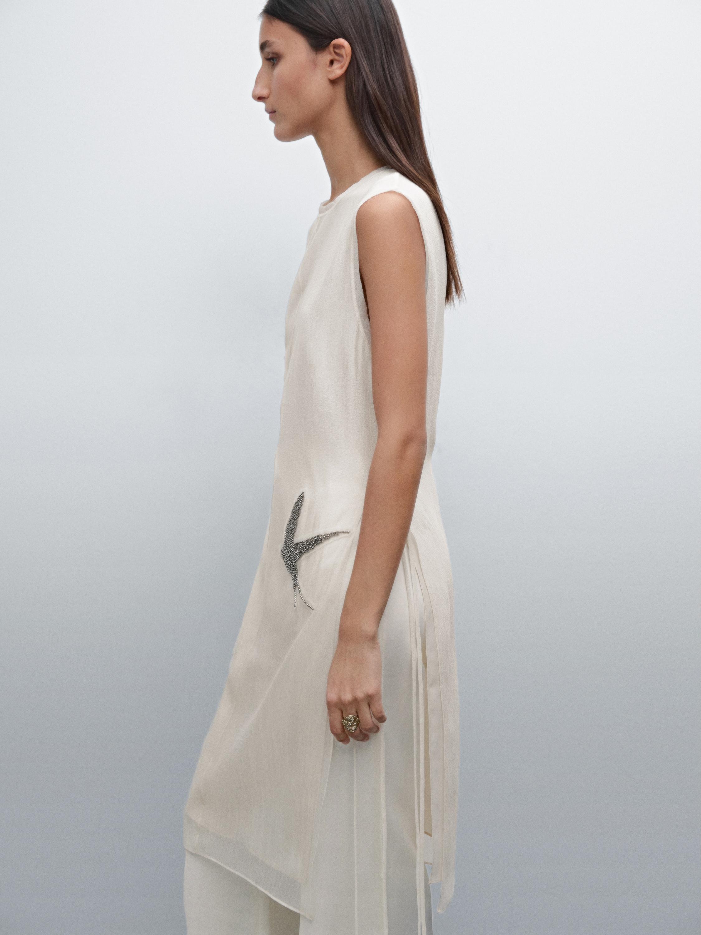 Tunic top with embroidered details