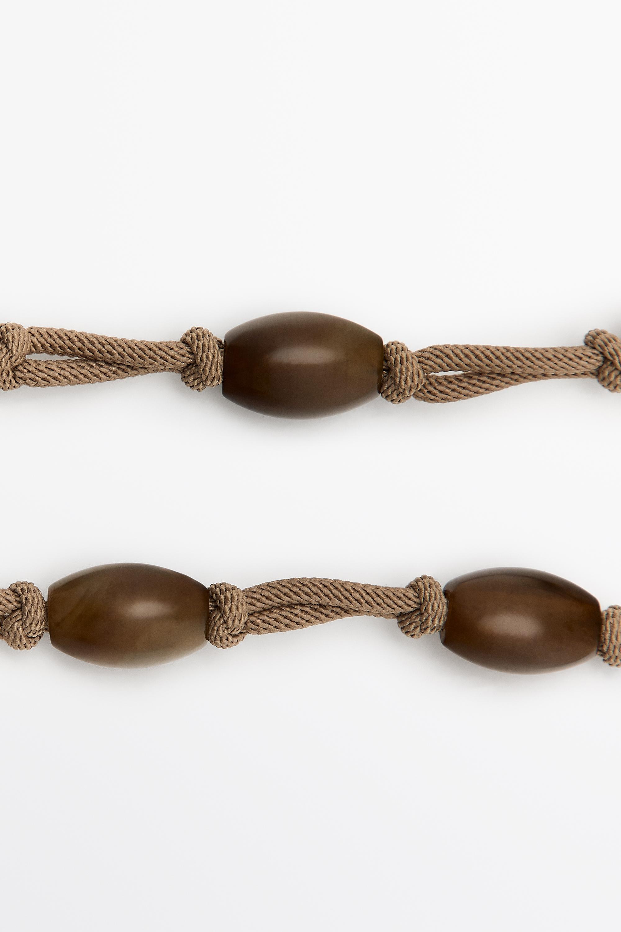 Gem-effect bead cord necklace — BROWN