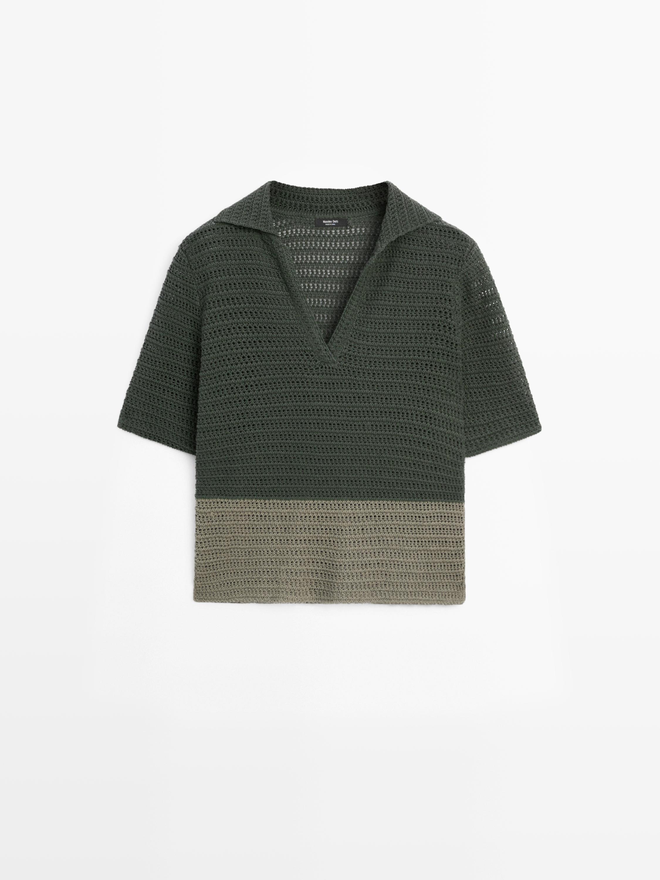 Front view of a green open-knit polo sweater with short sleeves and a V-neck. Lighter-toned bottom.