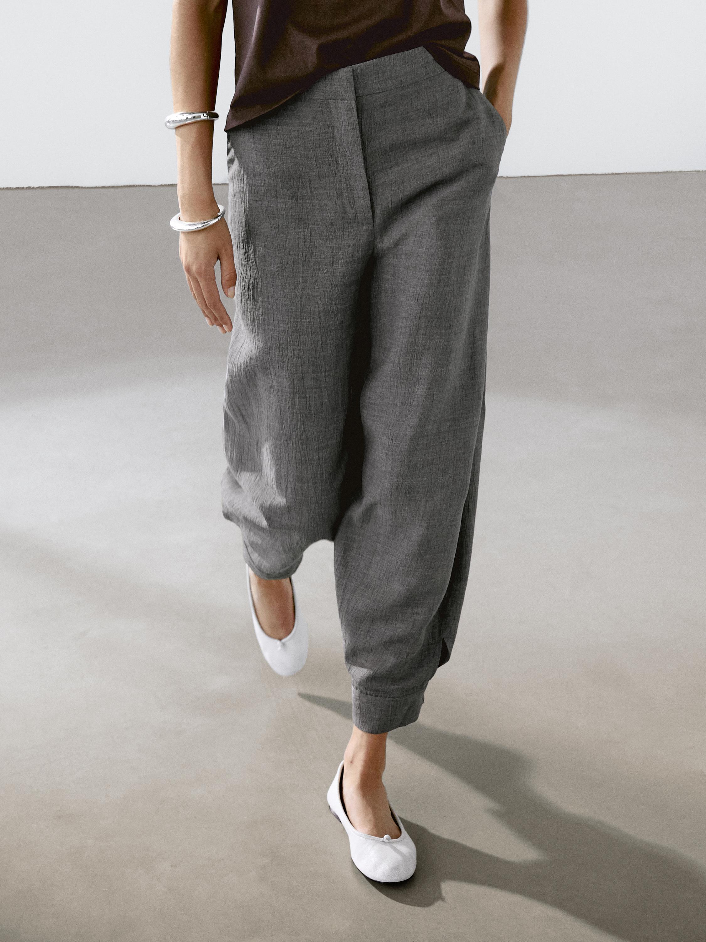 Balloon fit trousers with button details