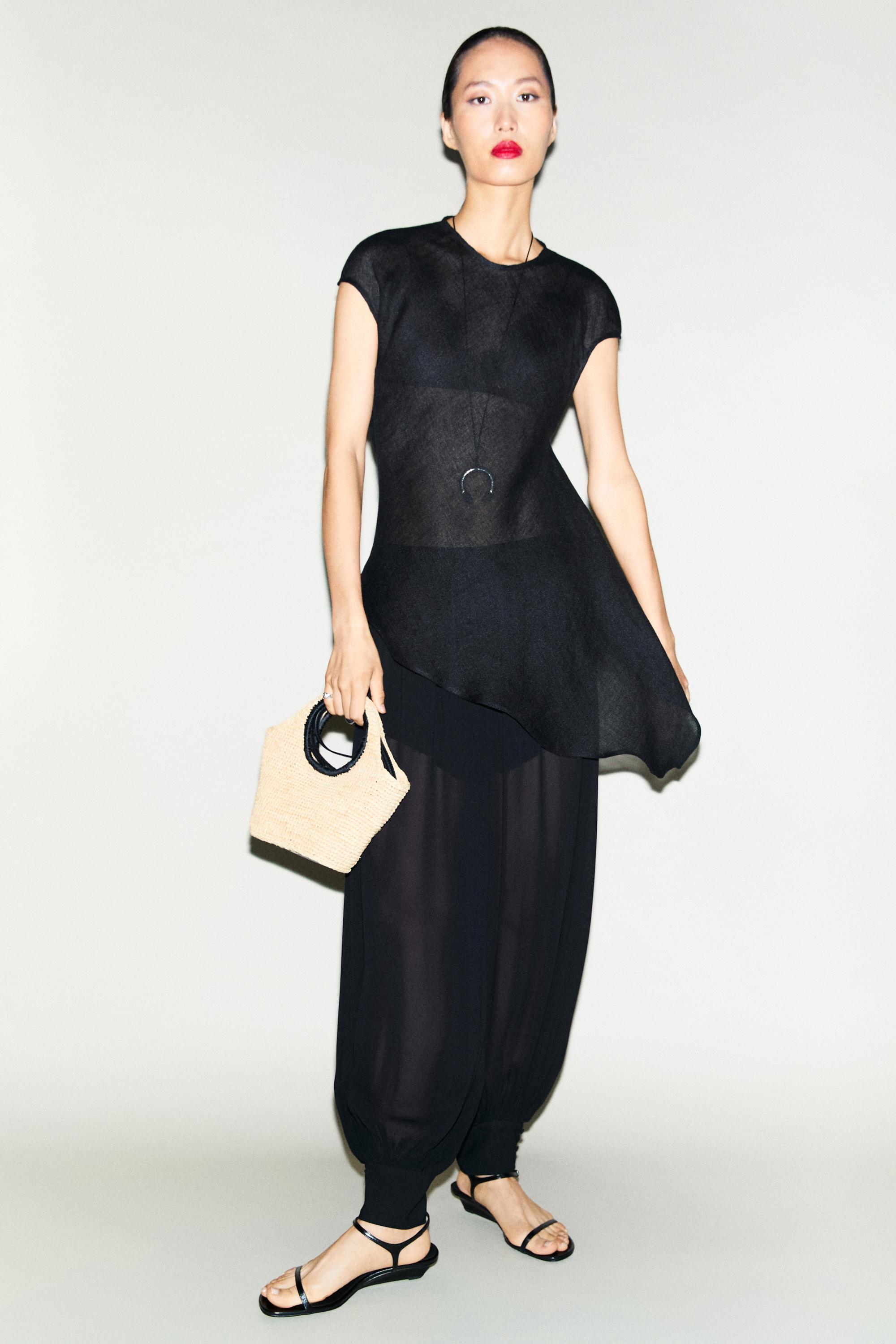 Semi-sheer sarouel trousers with button details — BLACK