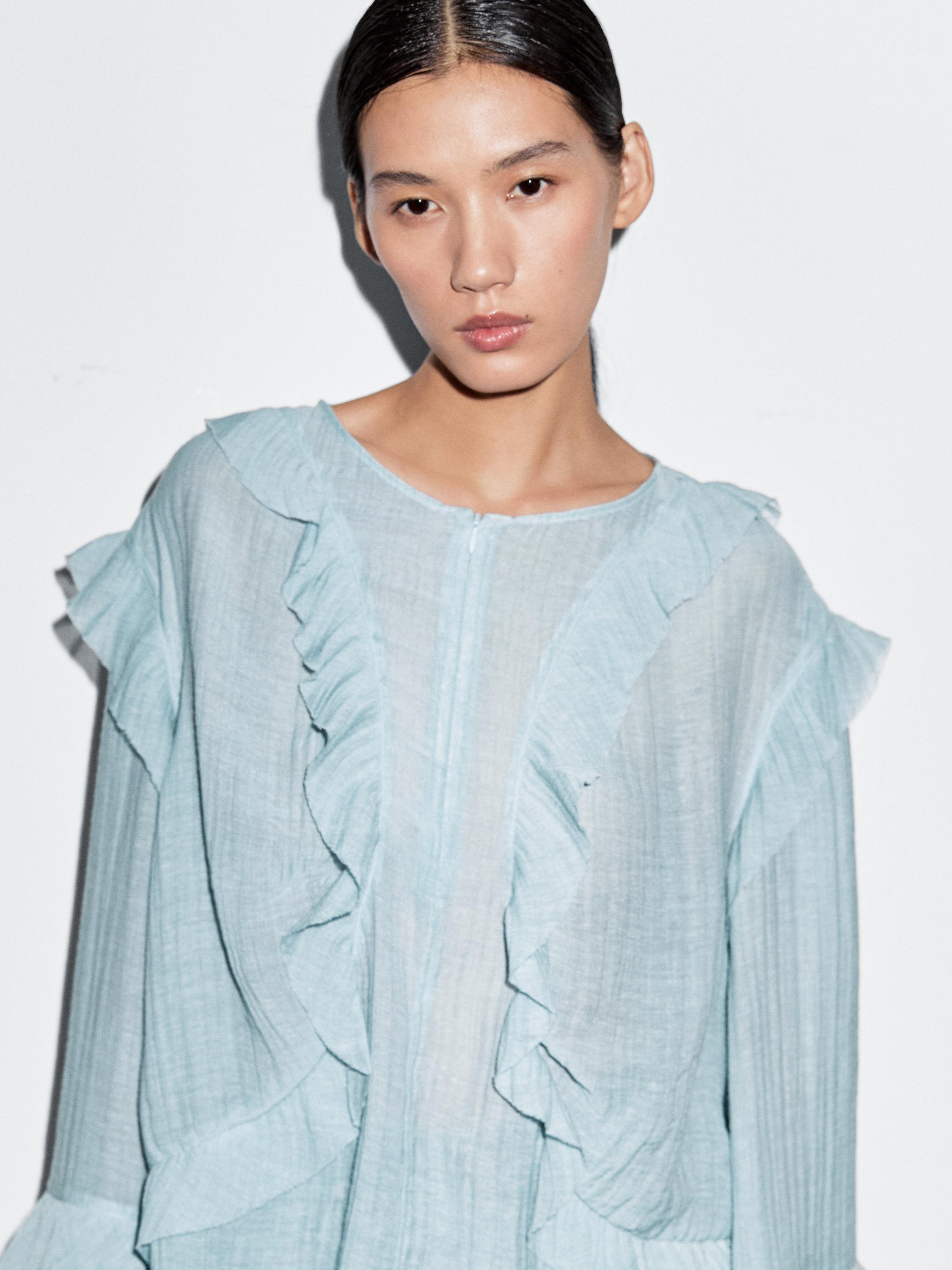 Flowing blouse with ruffles