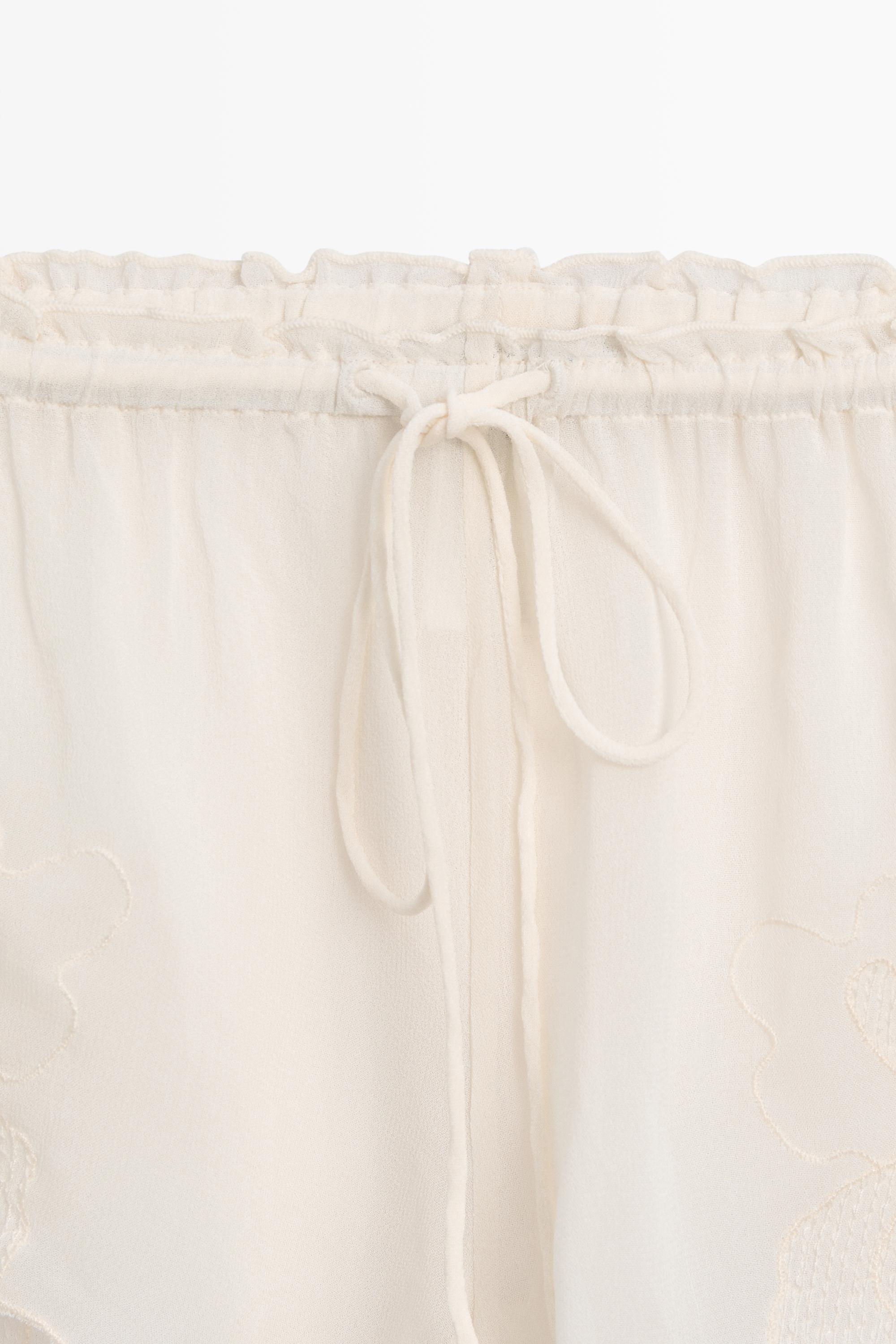 Flowing shorts with embroidered detail — CREAM