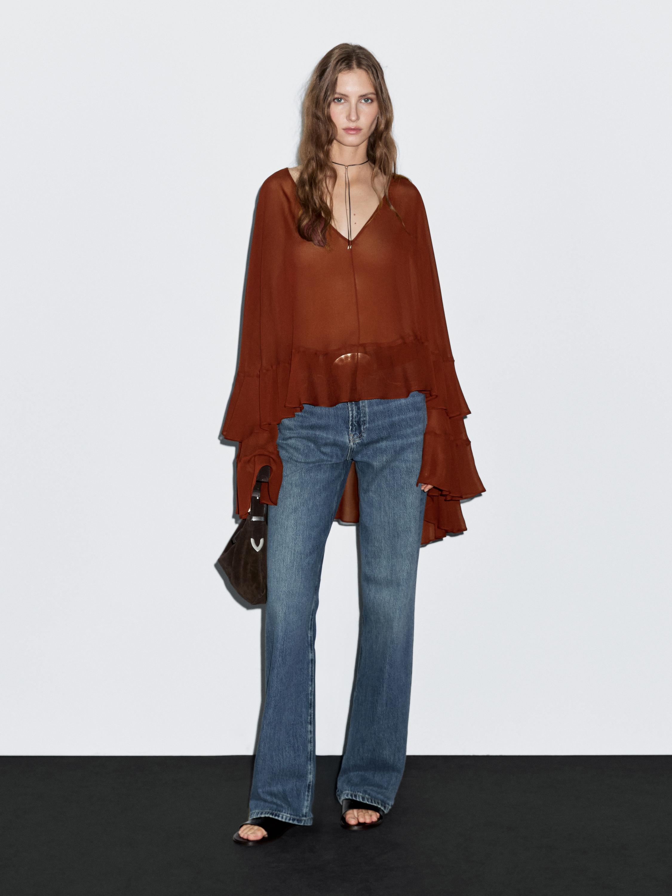 Cape-style blouse with ruffles