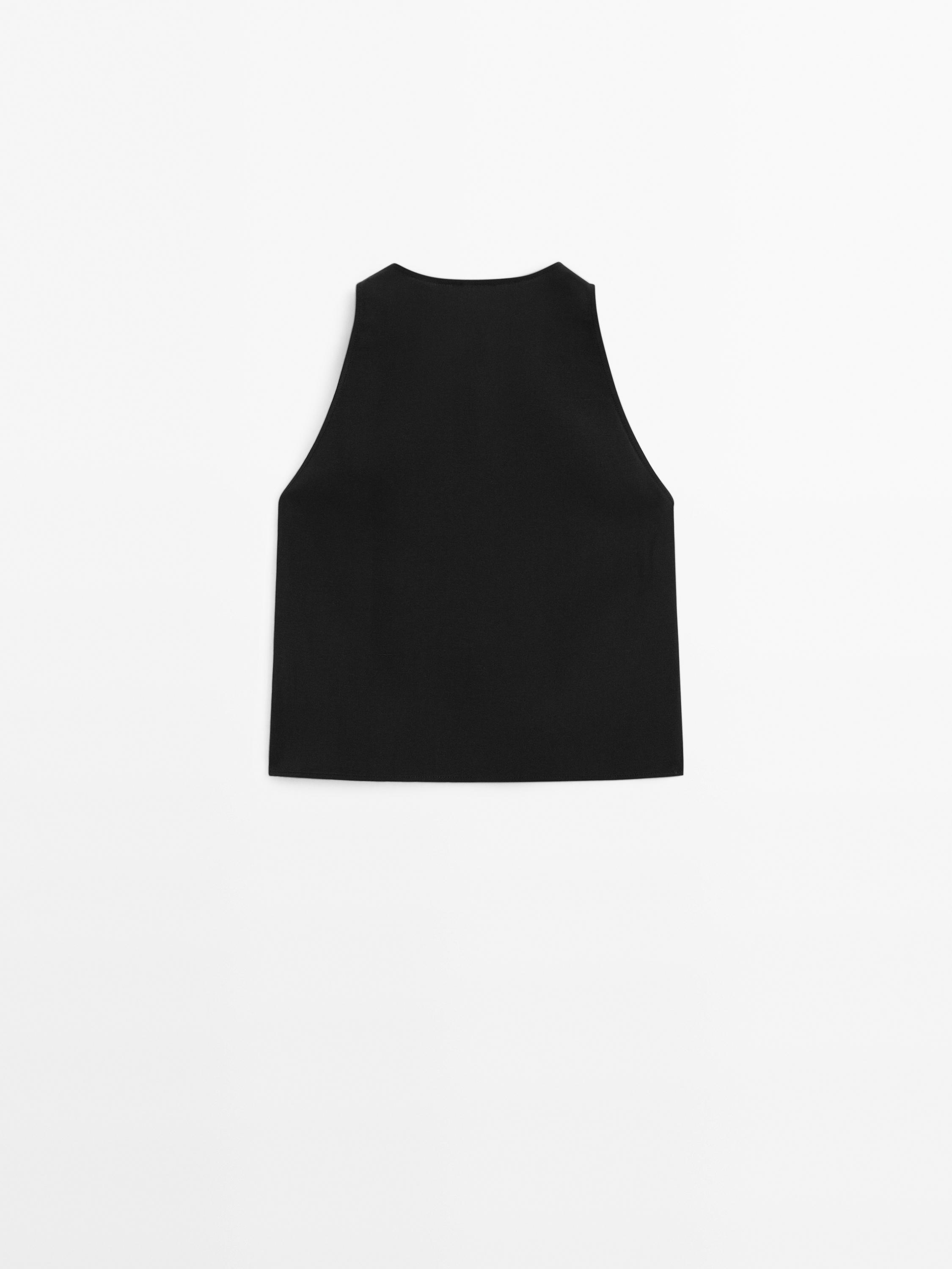 Top with buttons and topstitching on the chest