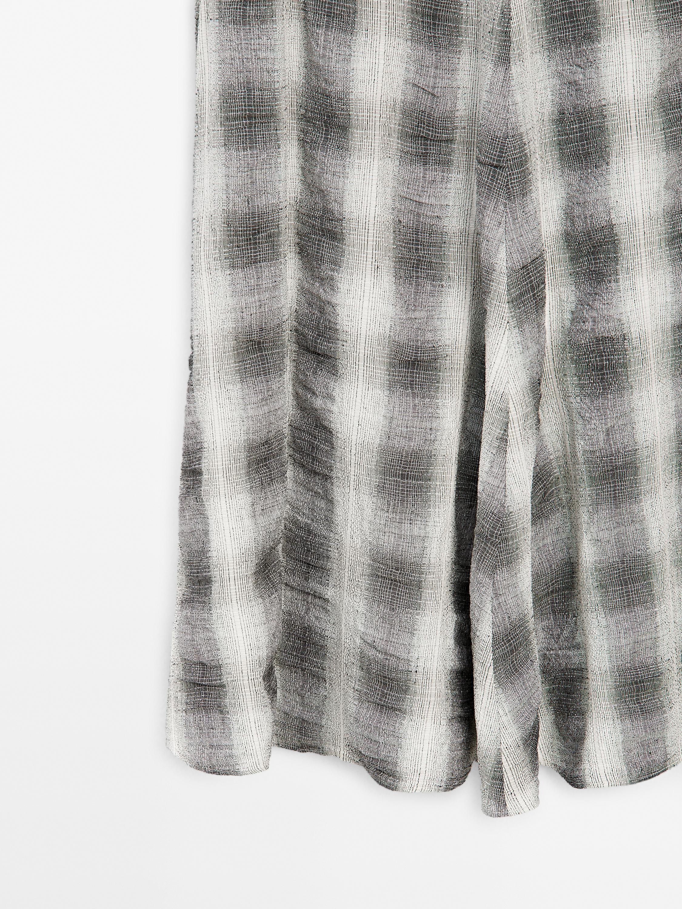 Long flared check skirt