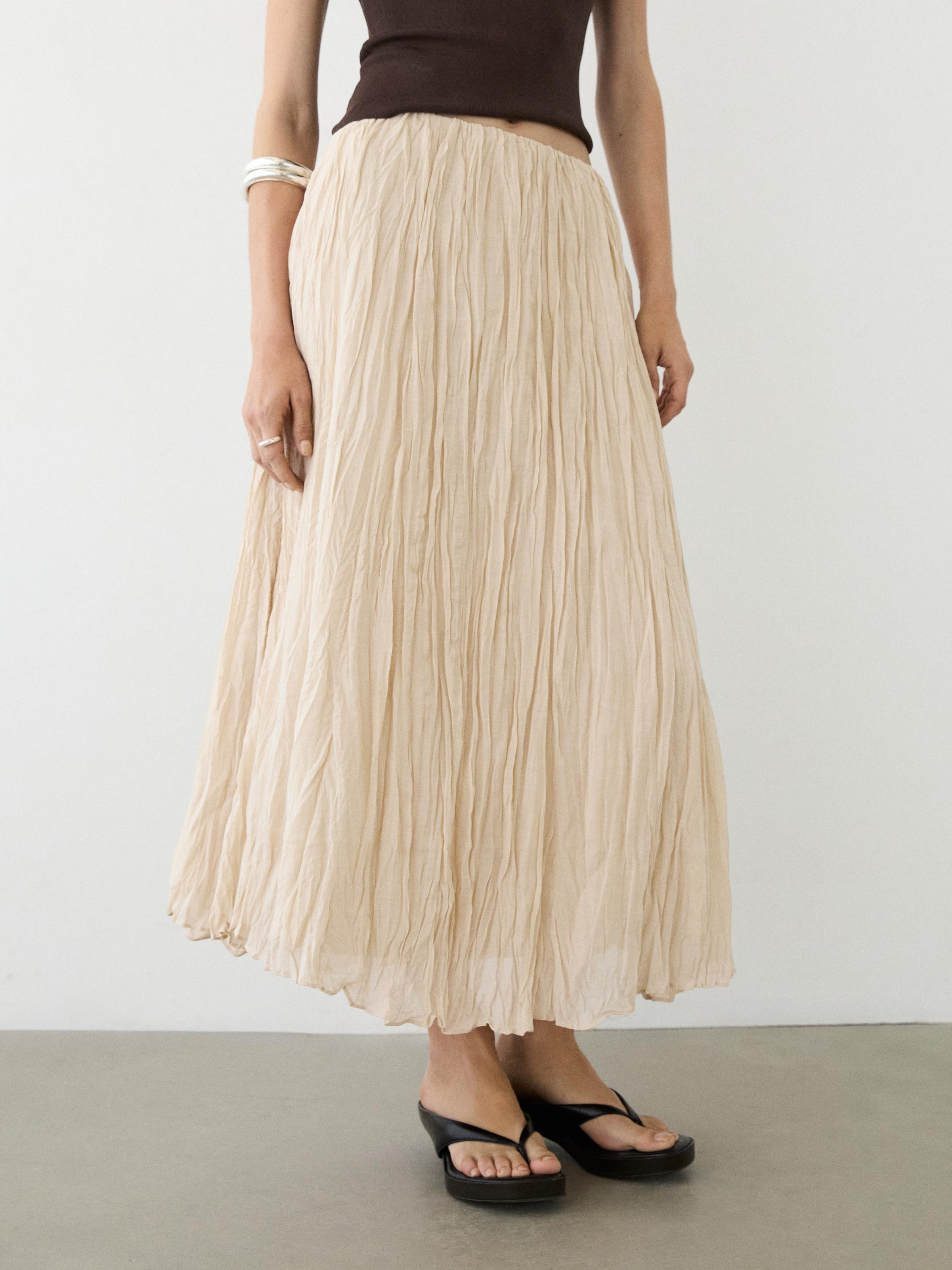 Flowing midi skirt with pleated detail — CREAM