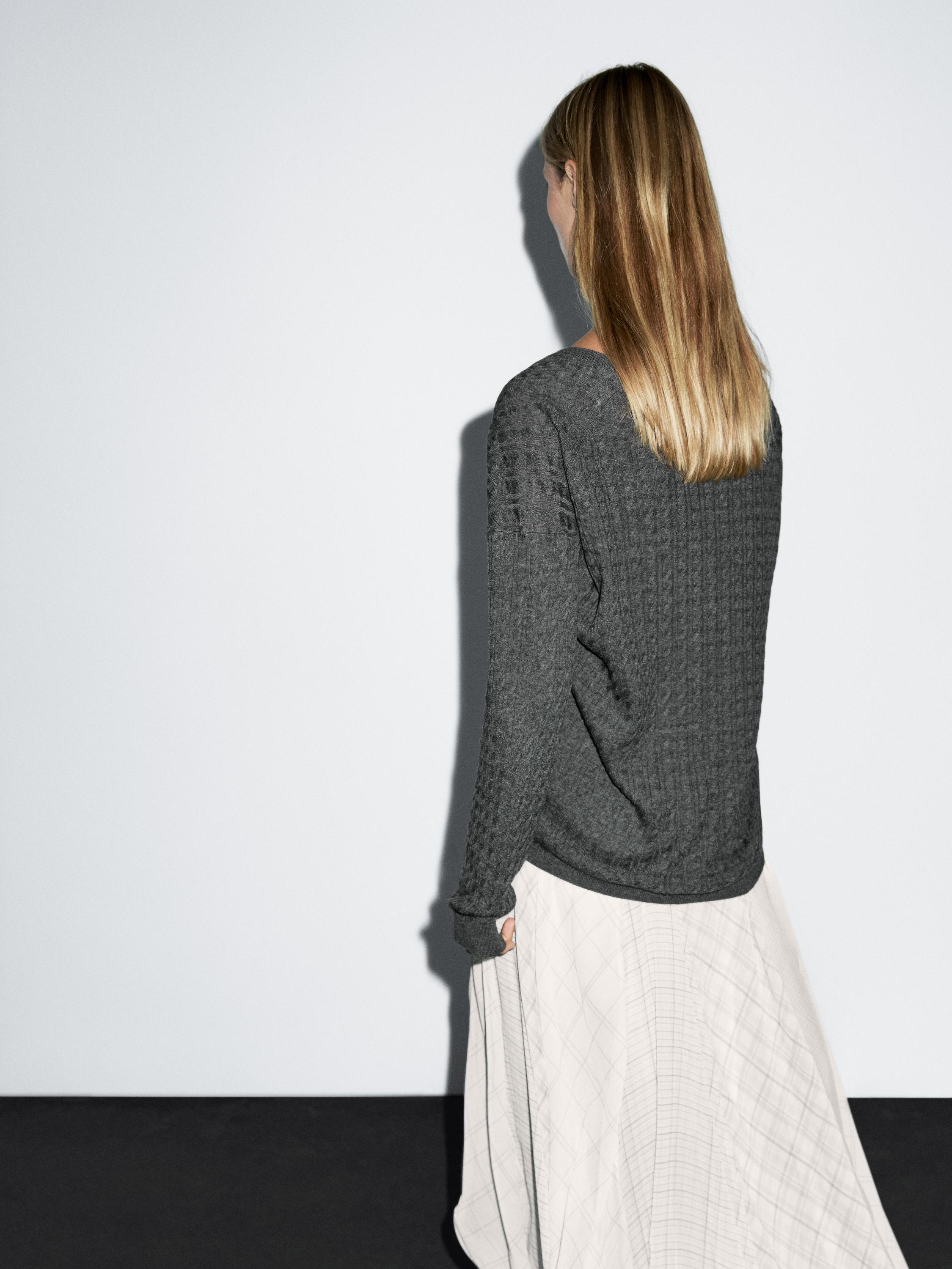 Jersey punto trenzado cuello pico