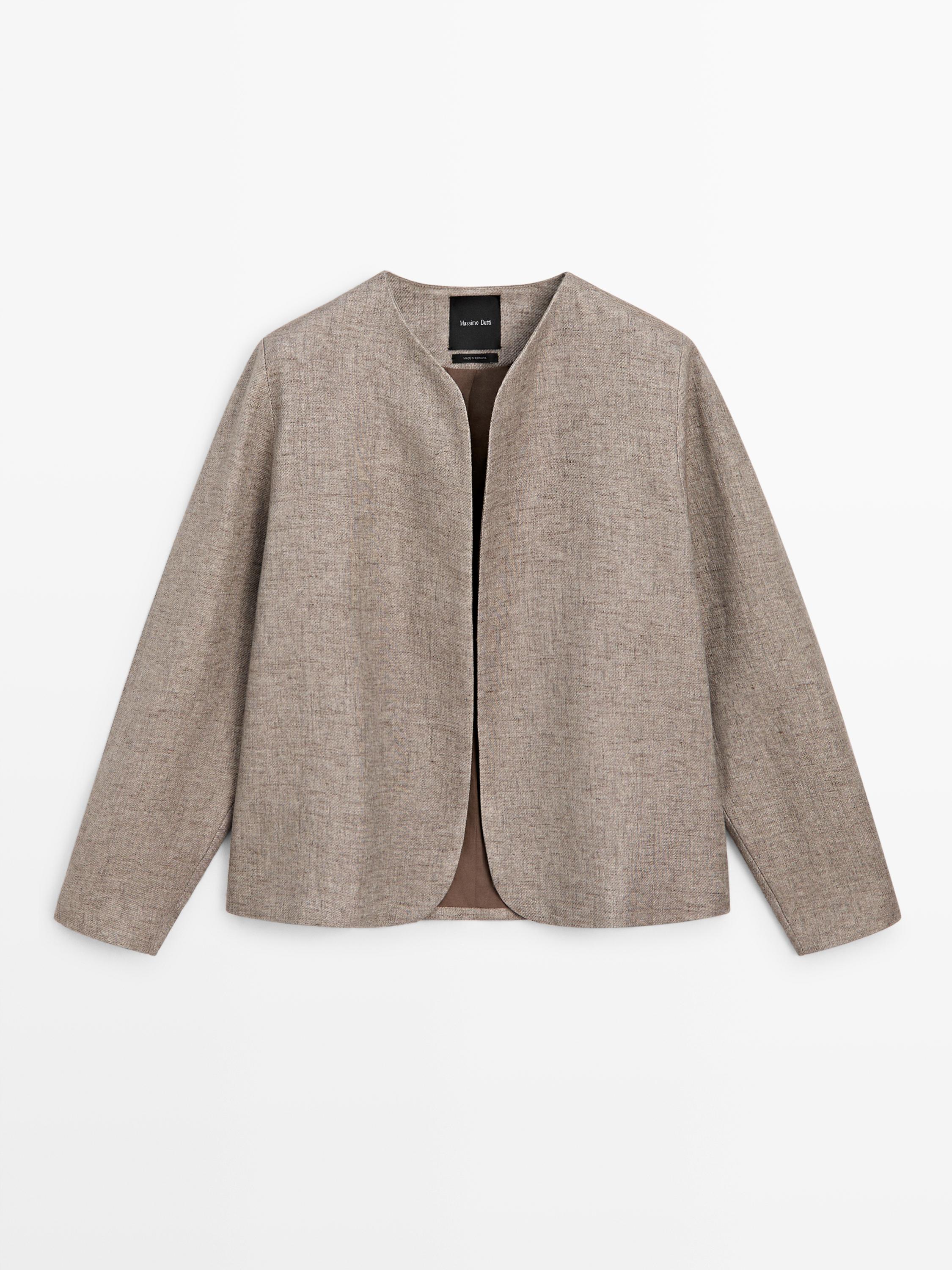 Front view of a taupe bomber jacket, collarless, with a straight cut and long sleeves.