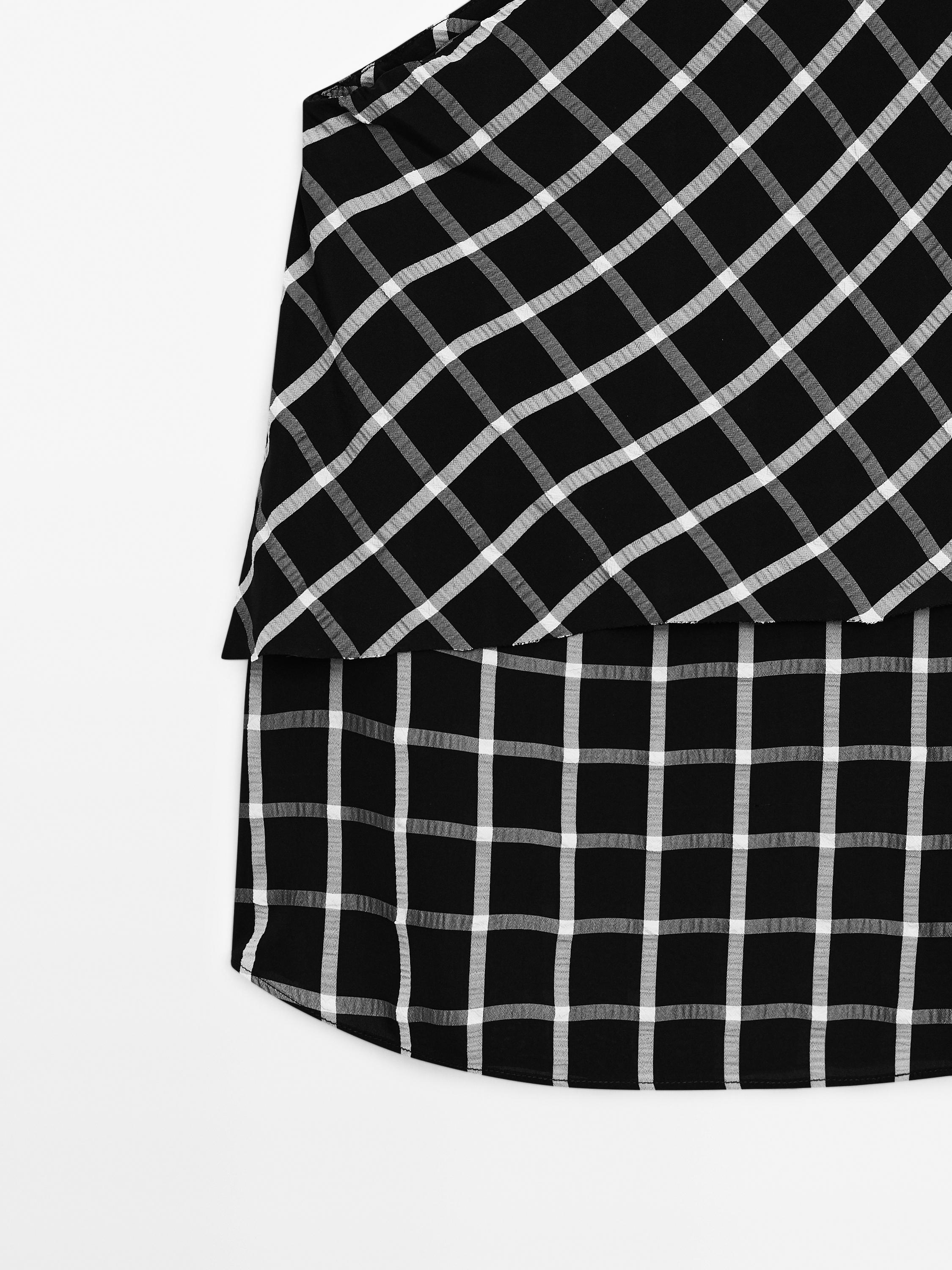 Checked top with asymmetric neckline