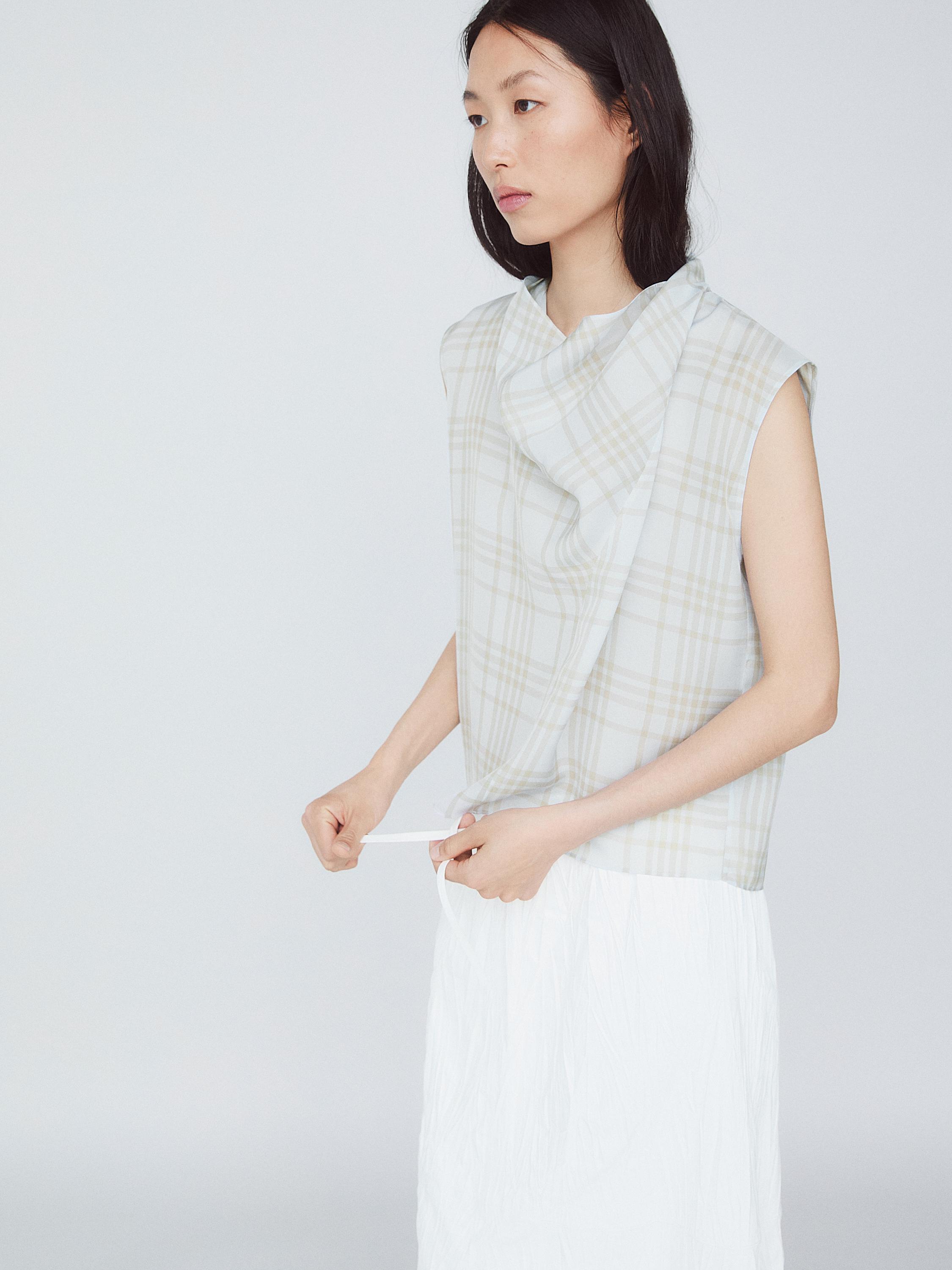 Draped neck check top
