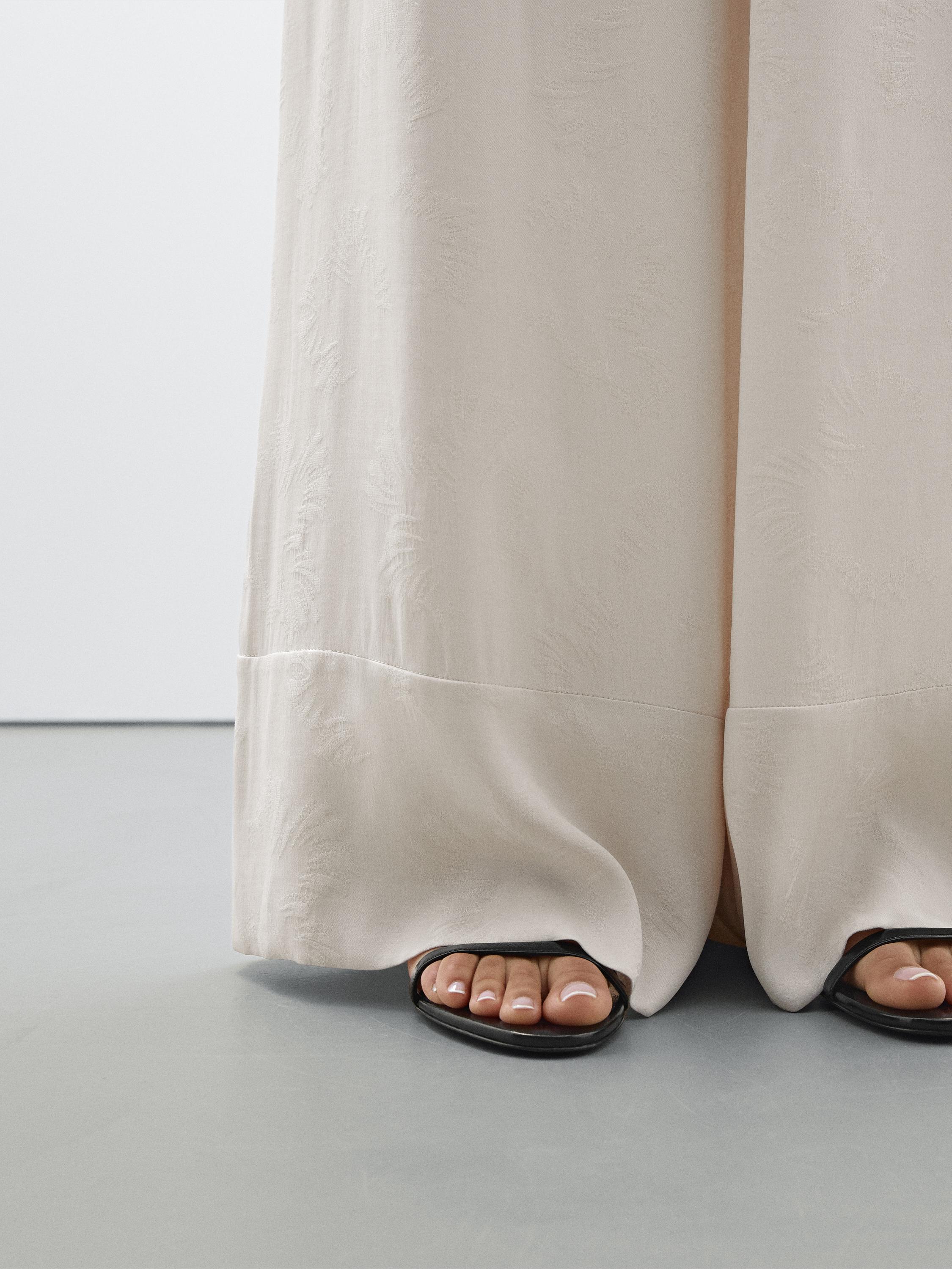 Printed fabric trousers with hem detail