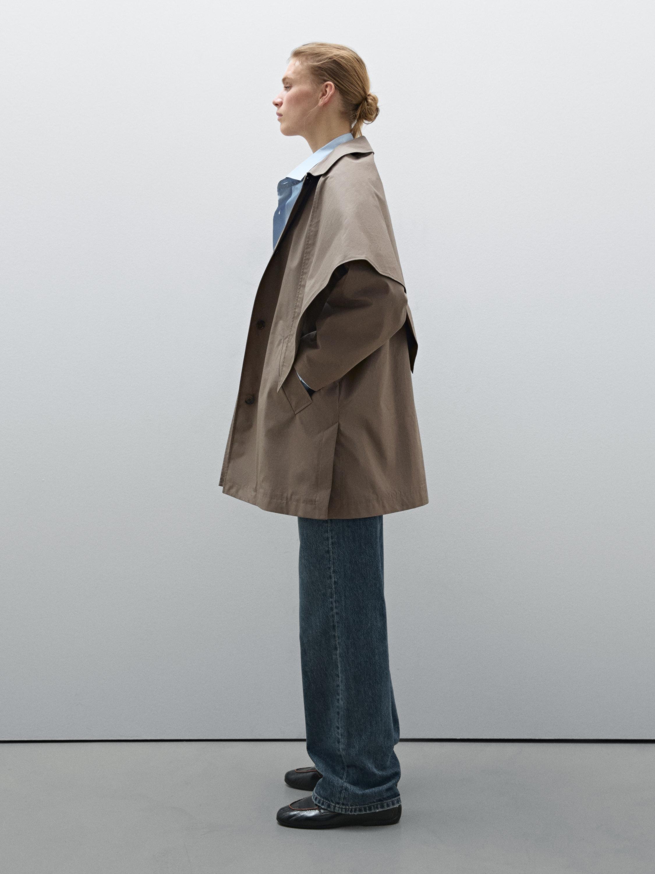 Trench coat with detachable scarf detail