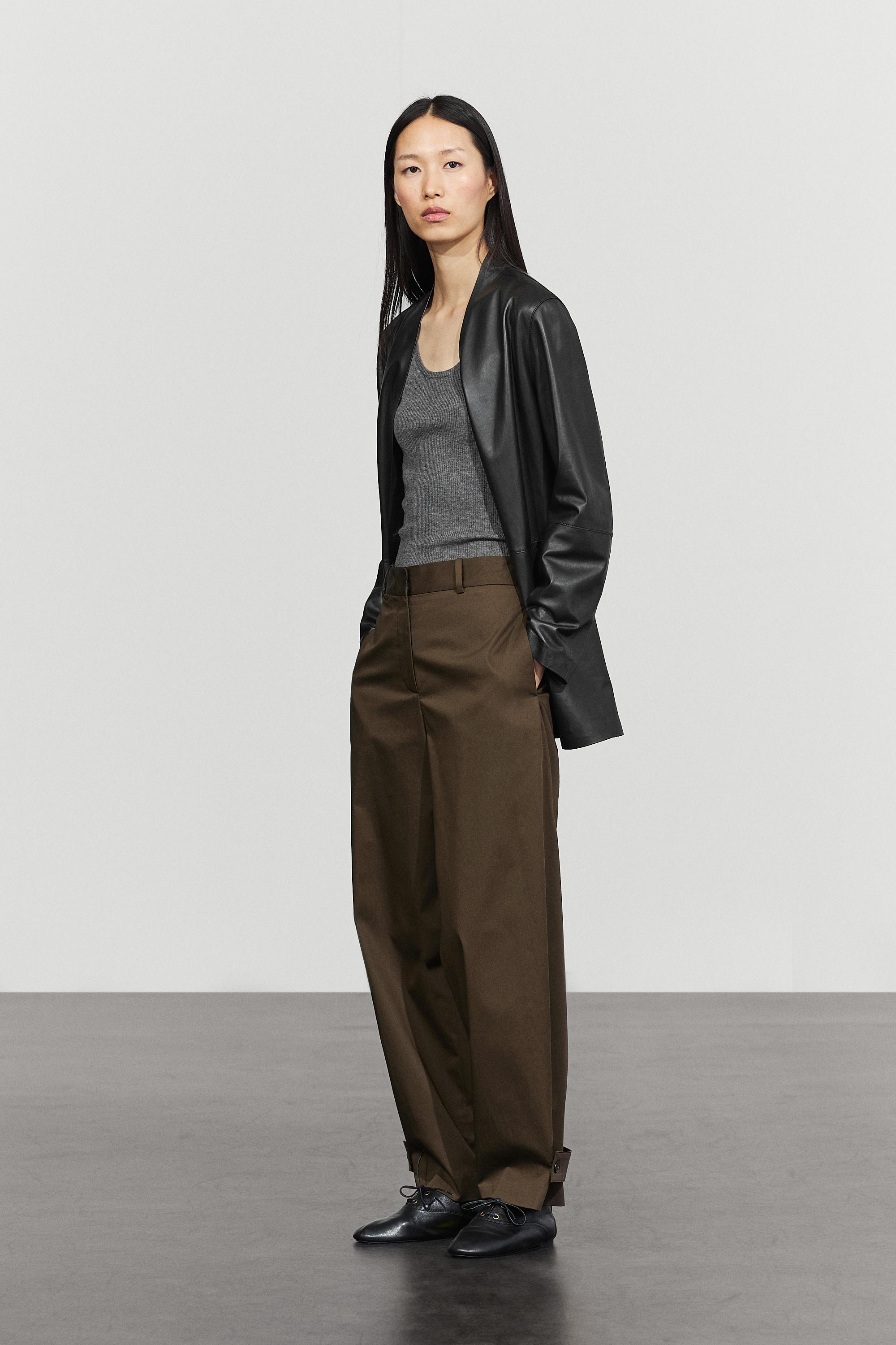 Pants with buttoned hem detail