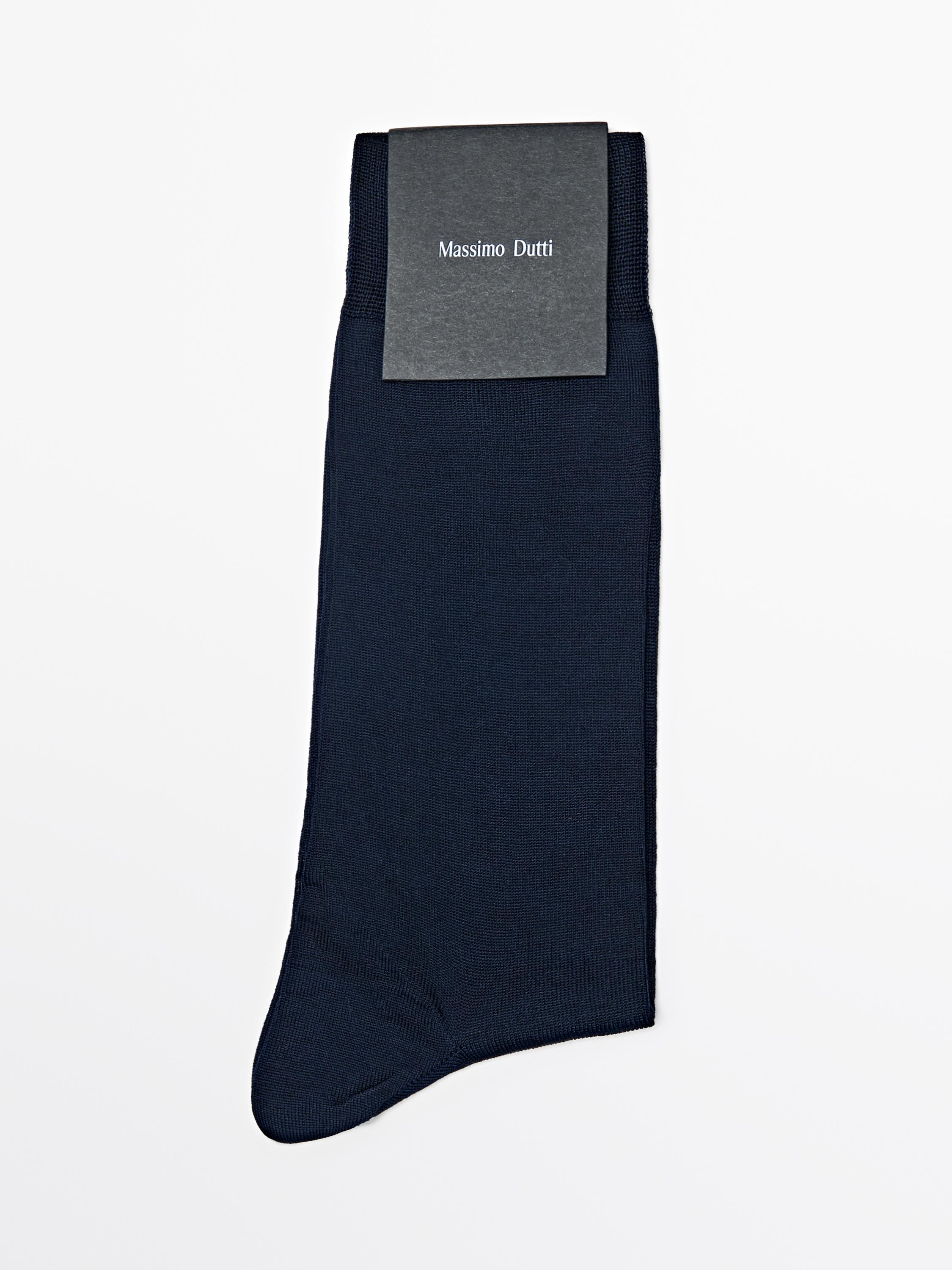 Front view of navy blue socks with "Massimo Dutti" text on the label.