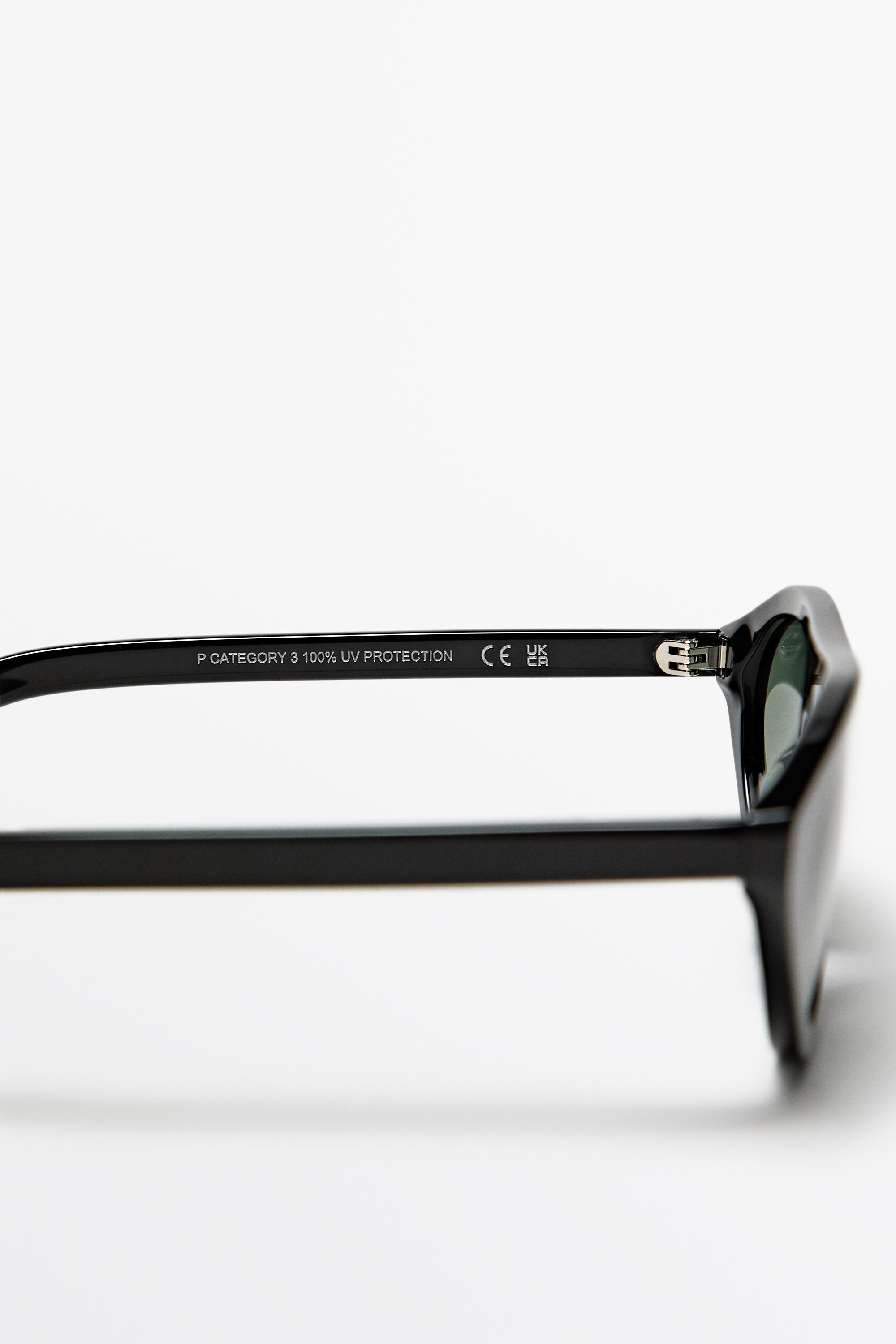 Oval sunglasses — BLACK