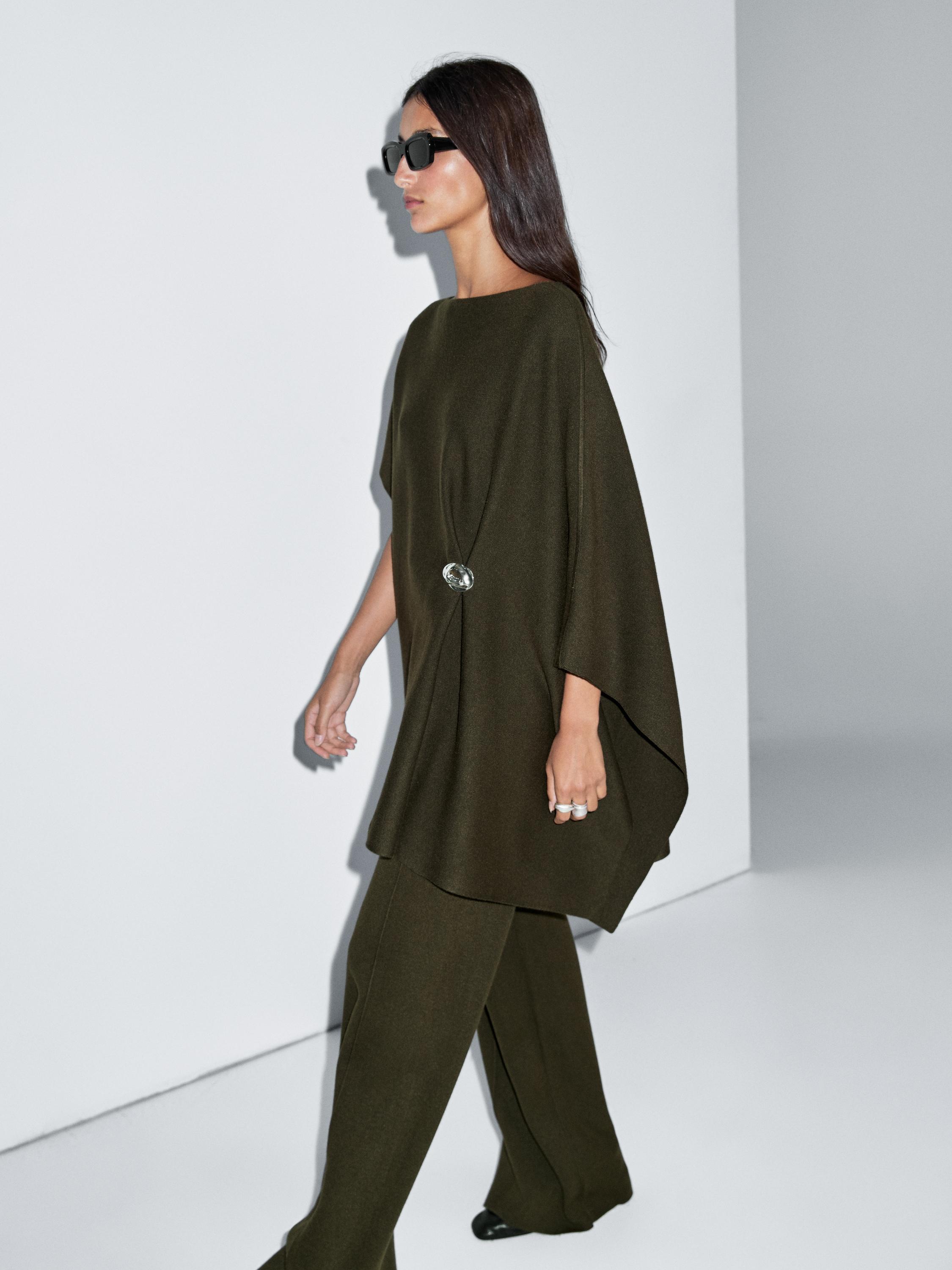 Olive green tunic set with side clasp and matching wide-leg pants.