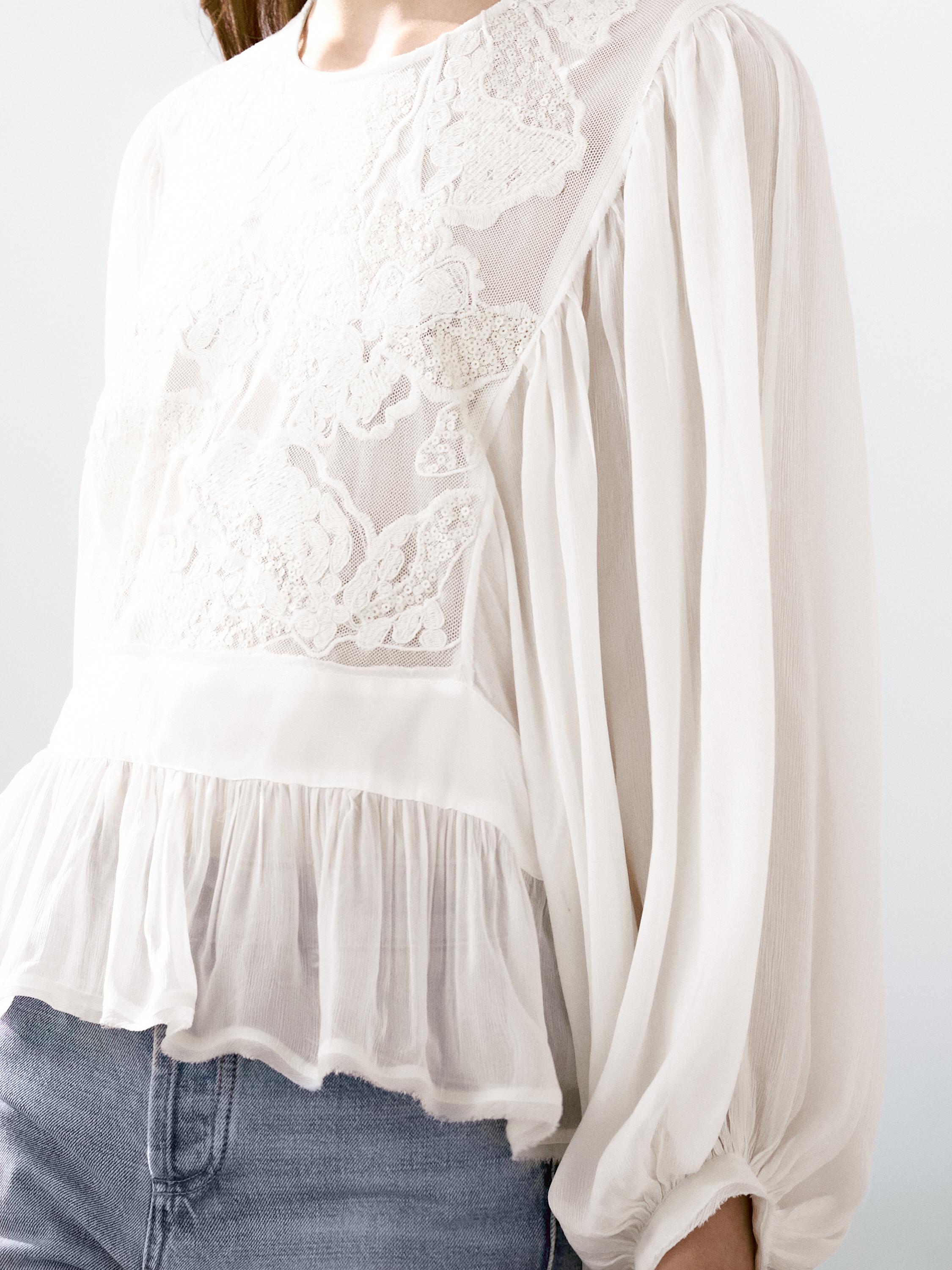 Flowing embroidered peplum blouse