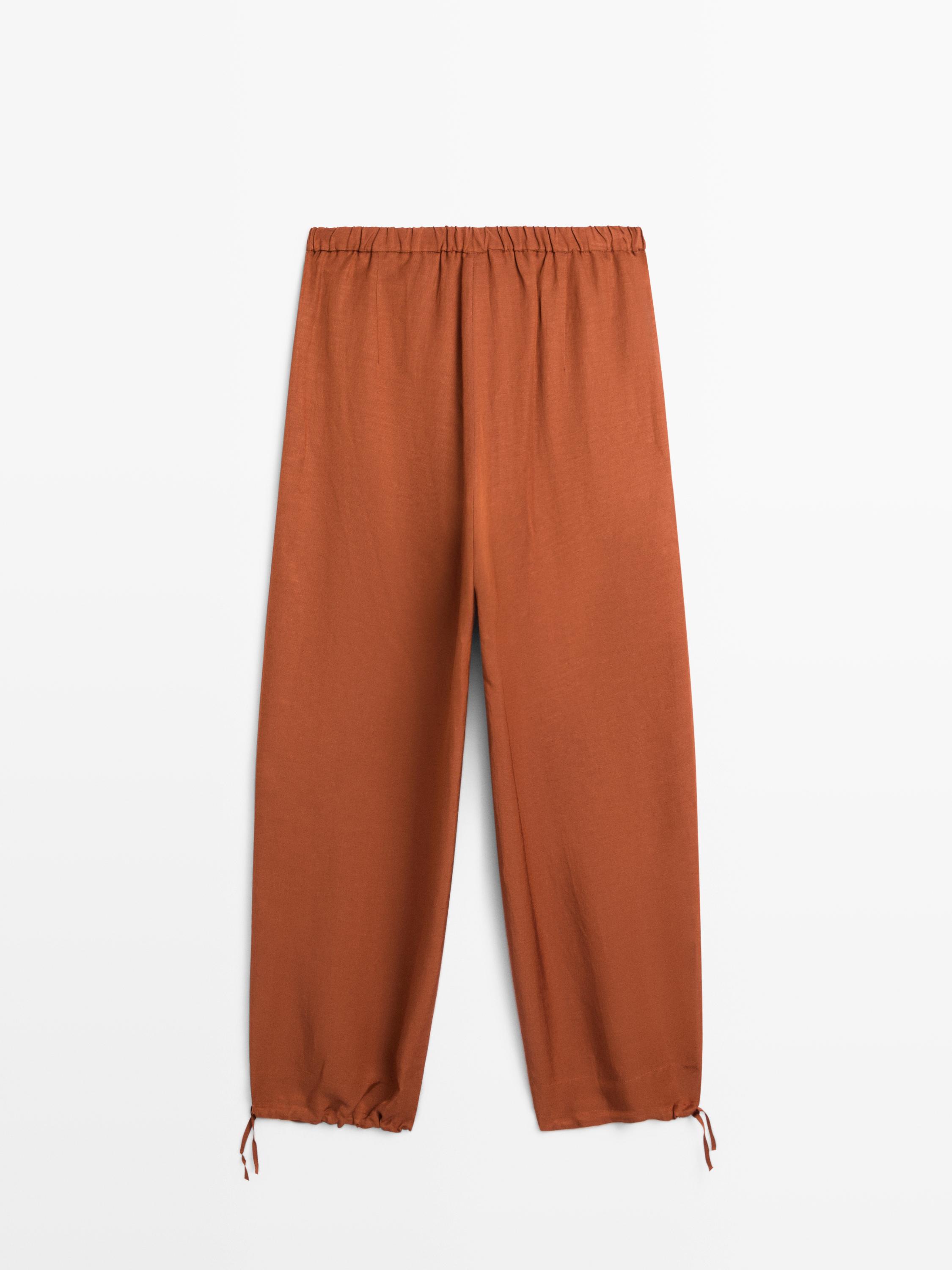 Flowing trousers with tie detail — ORANGE