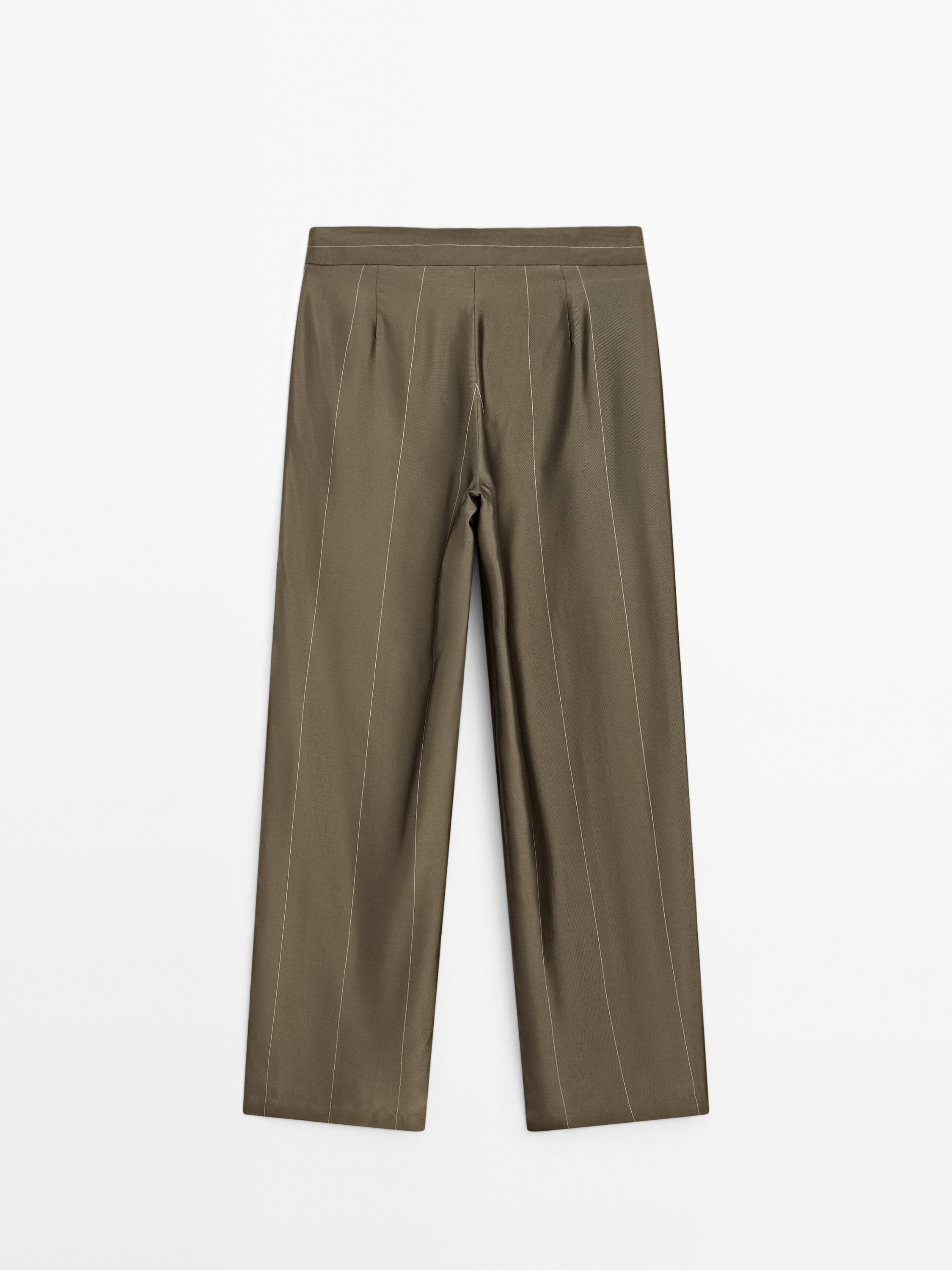Flowing trousers with striped details