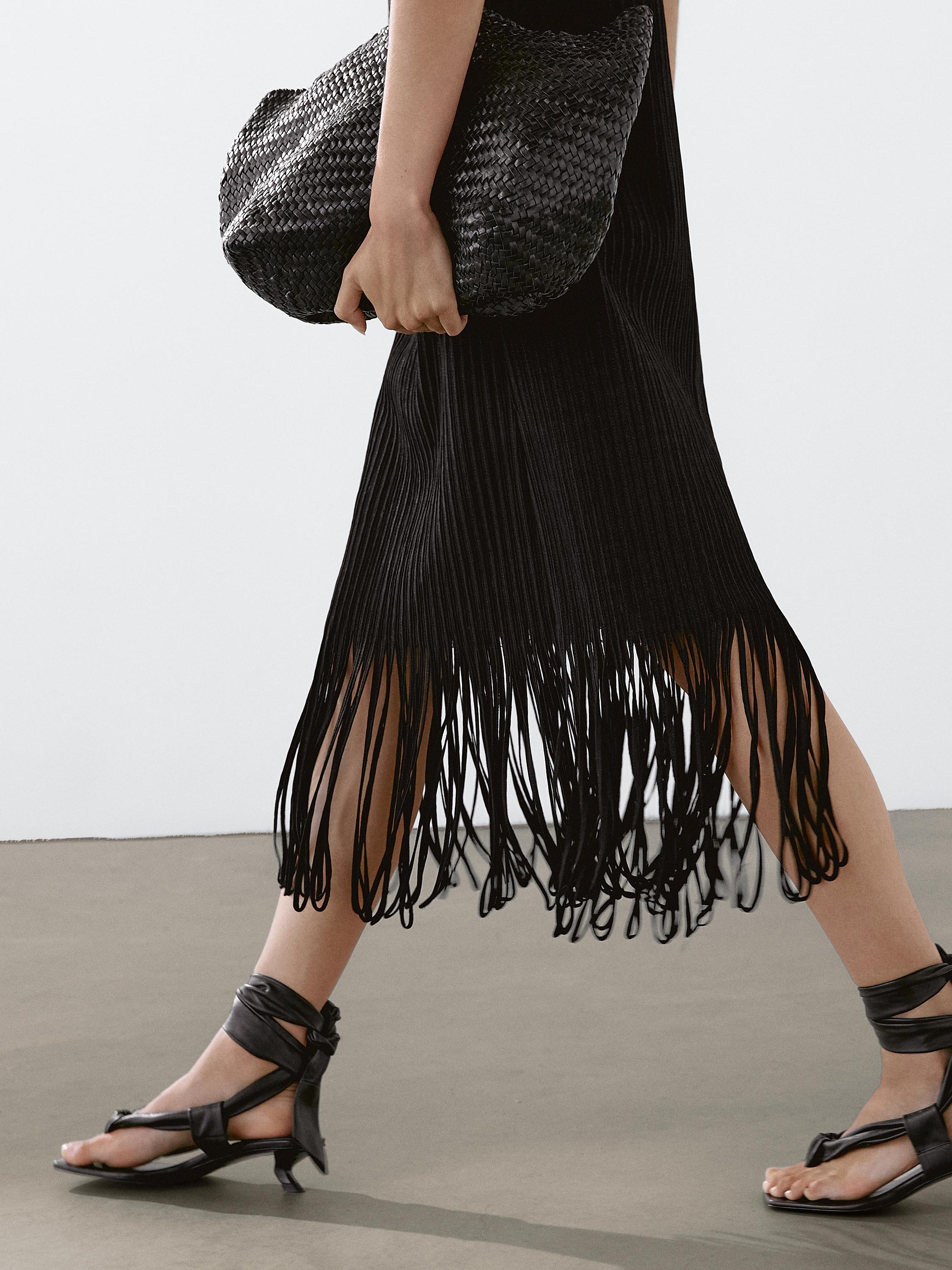 Textured knit dress with fringed hem