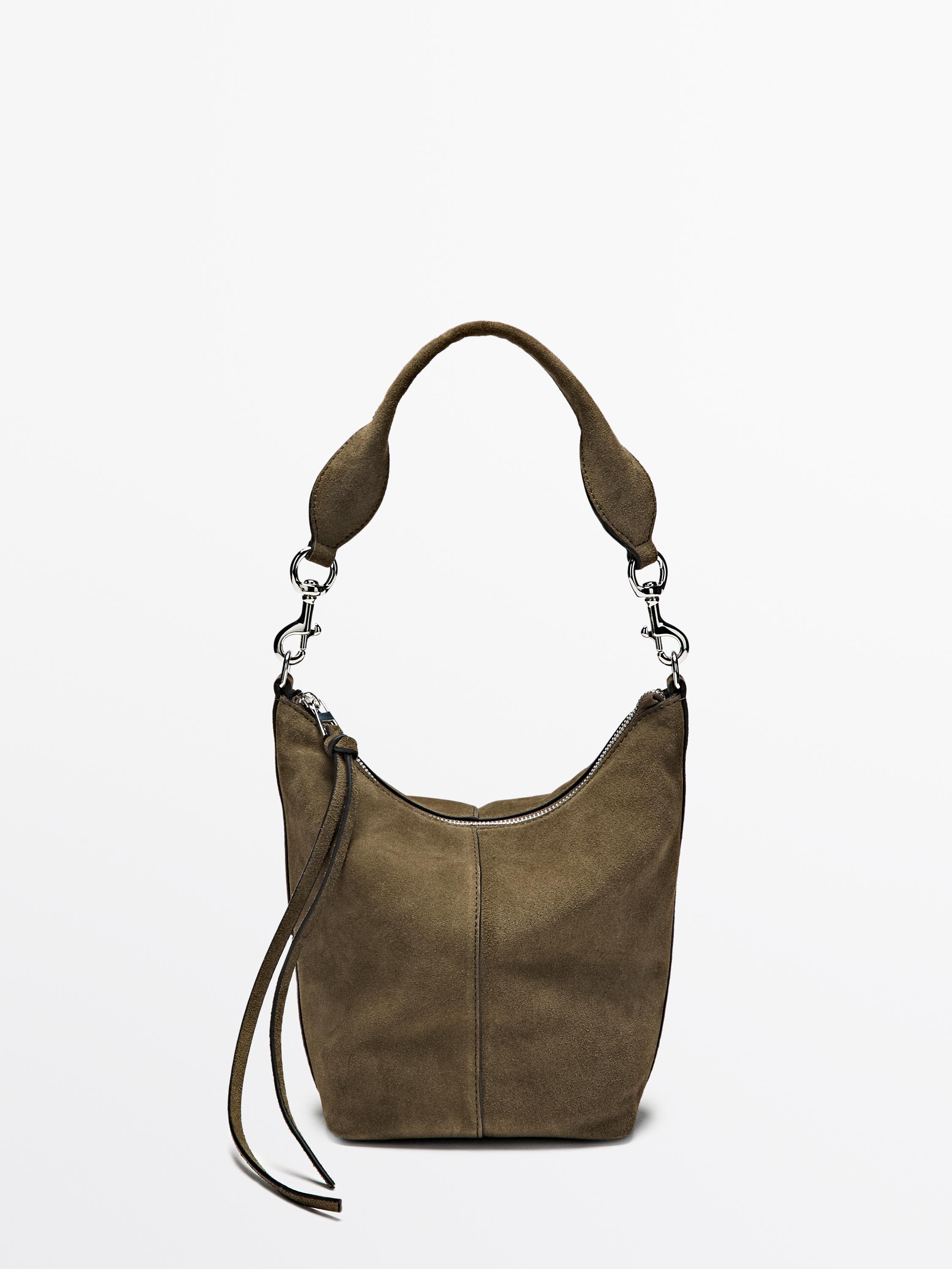 Front view of a khaki handbag with a detachable top handle and zipper closure.