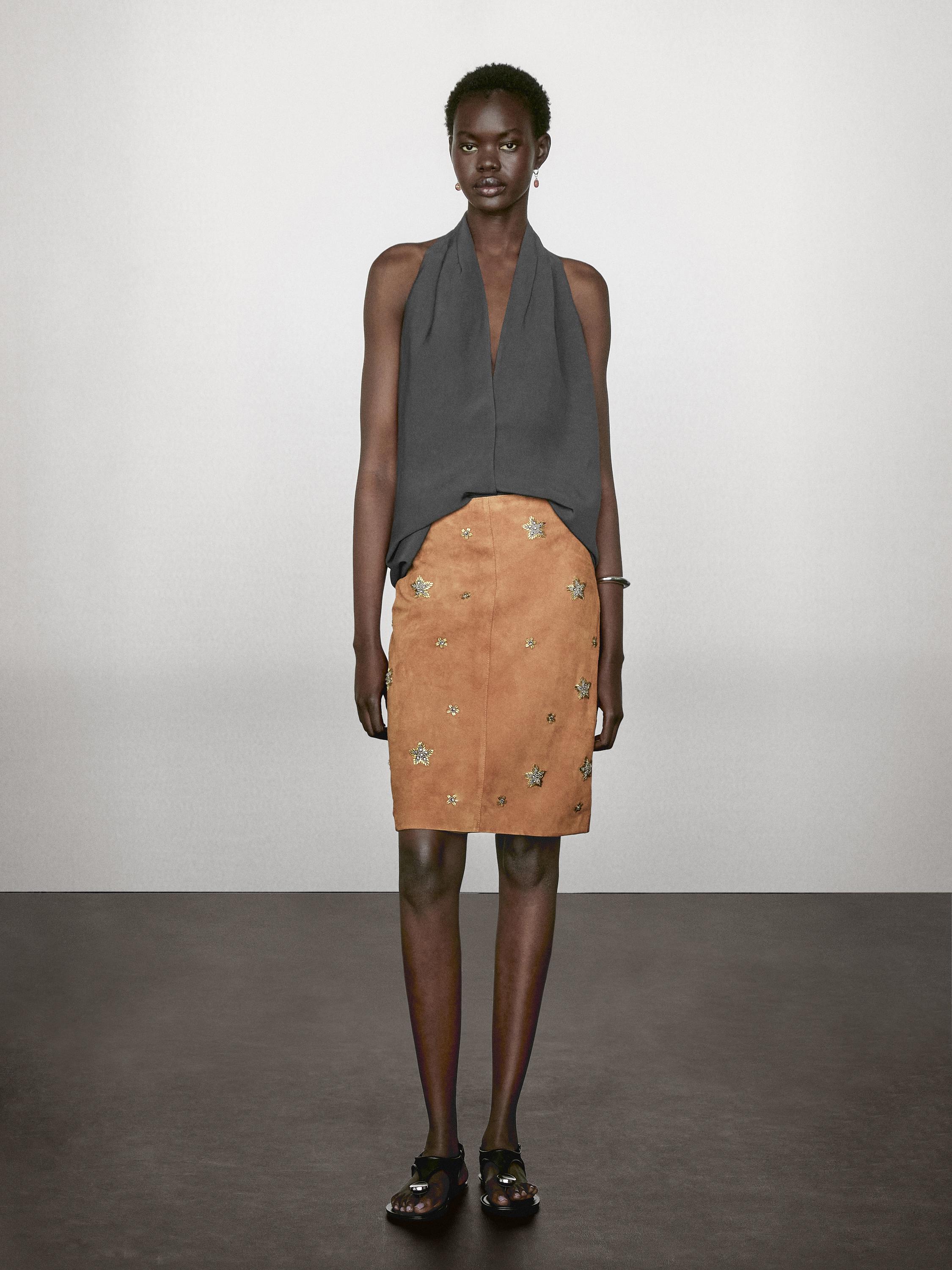 Suede leather skirt with rhinestone detail