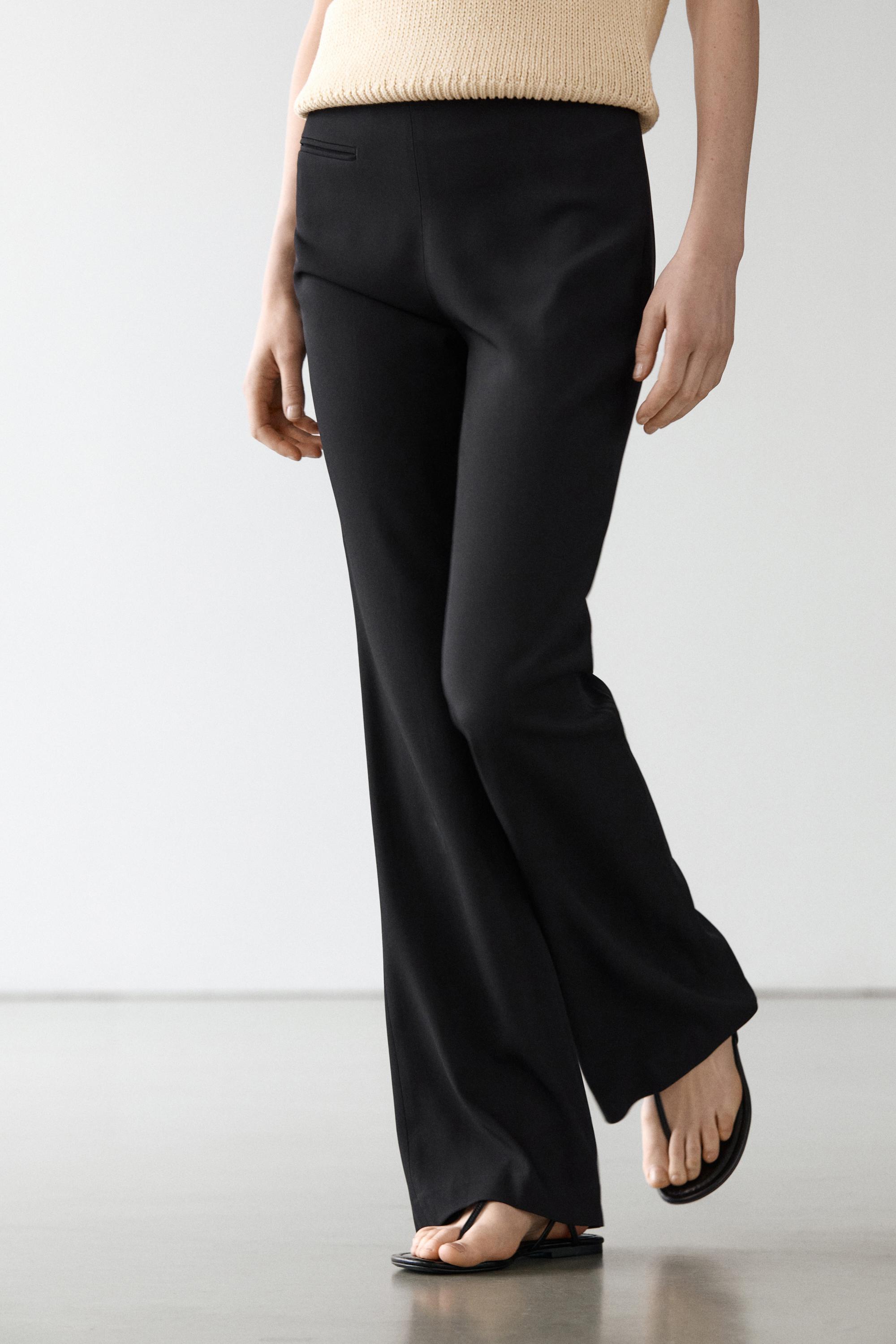 Flared trousers with pocket — BLACK
