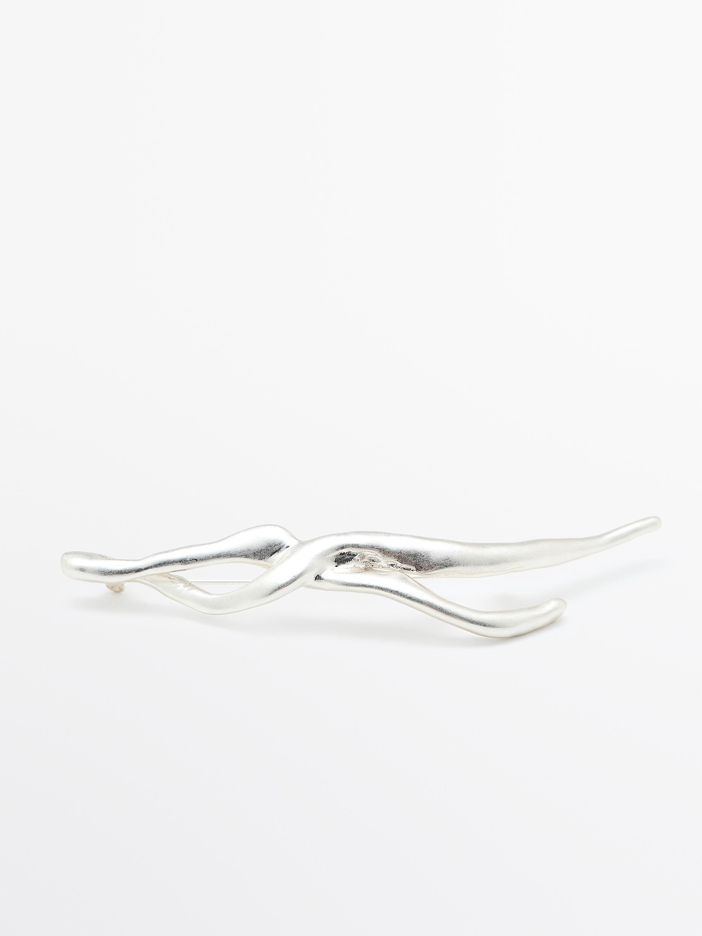 Abstract metal brooch