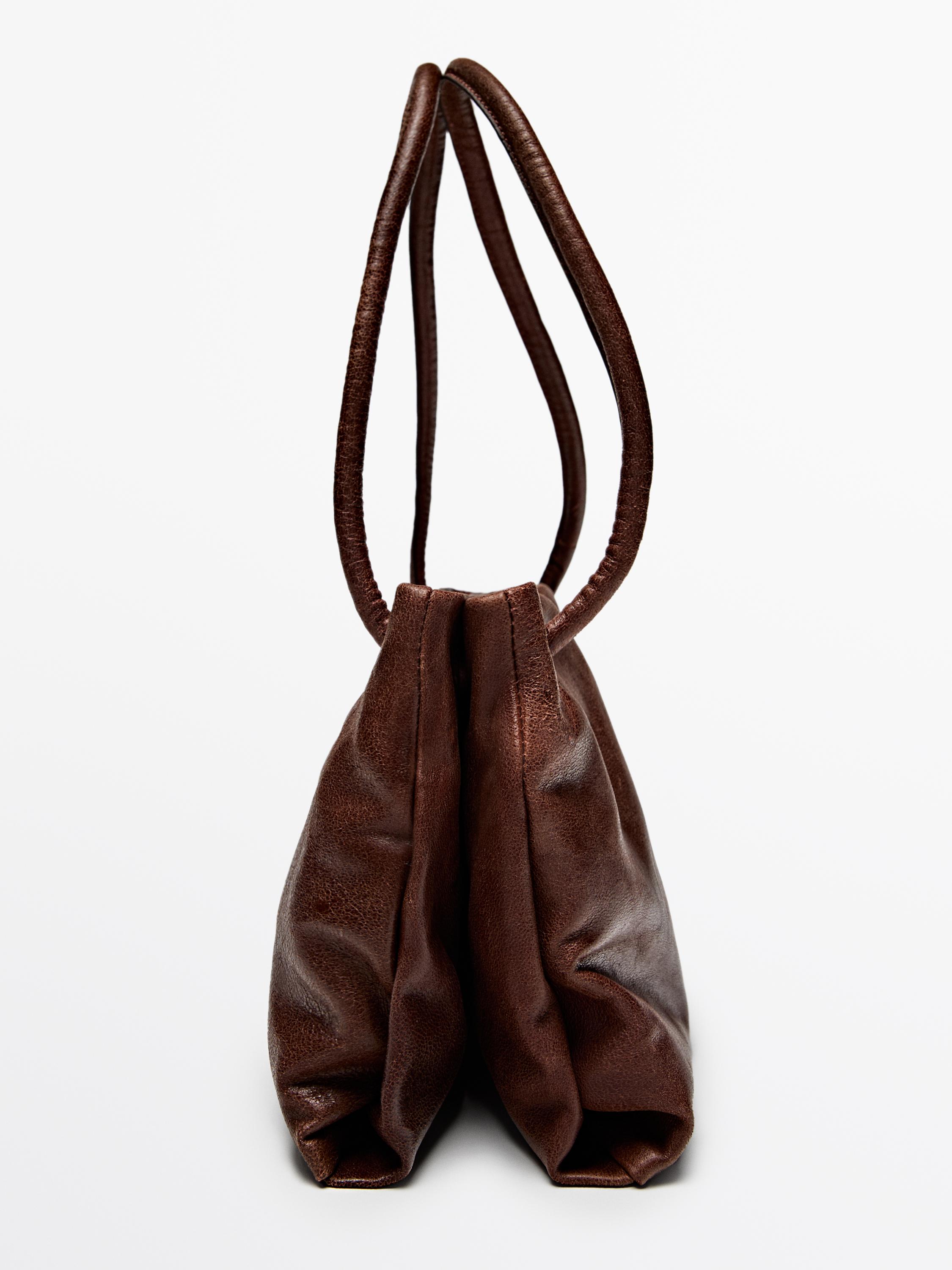 Small nappa leather bag with compartments