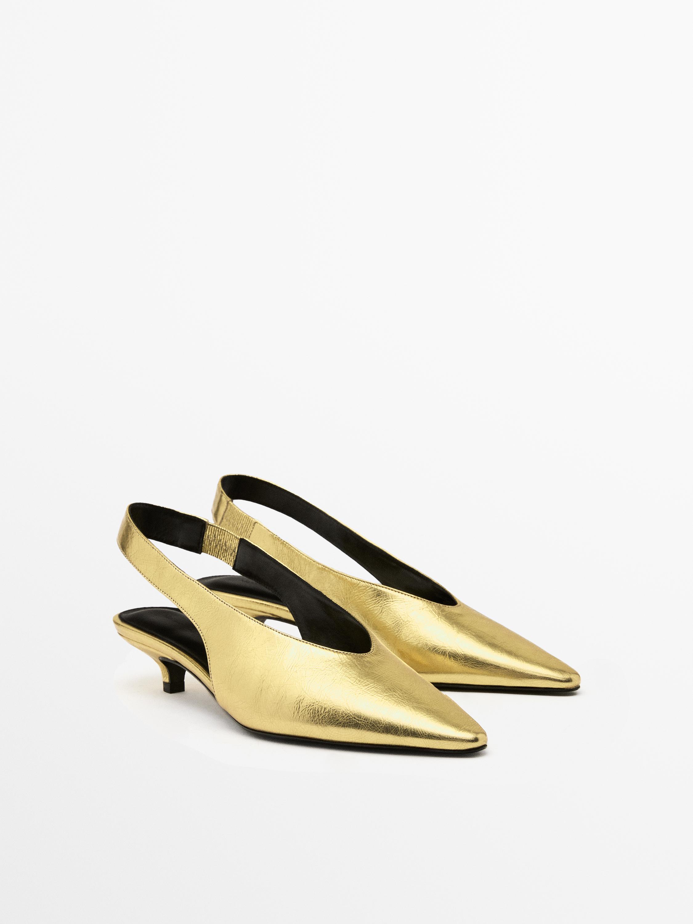 Gold high-heel slingback shoes