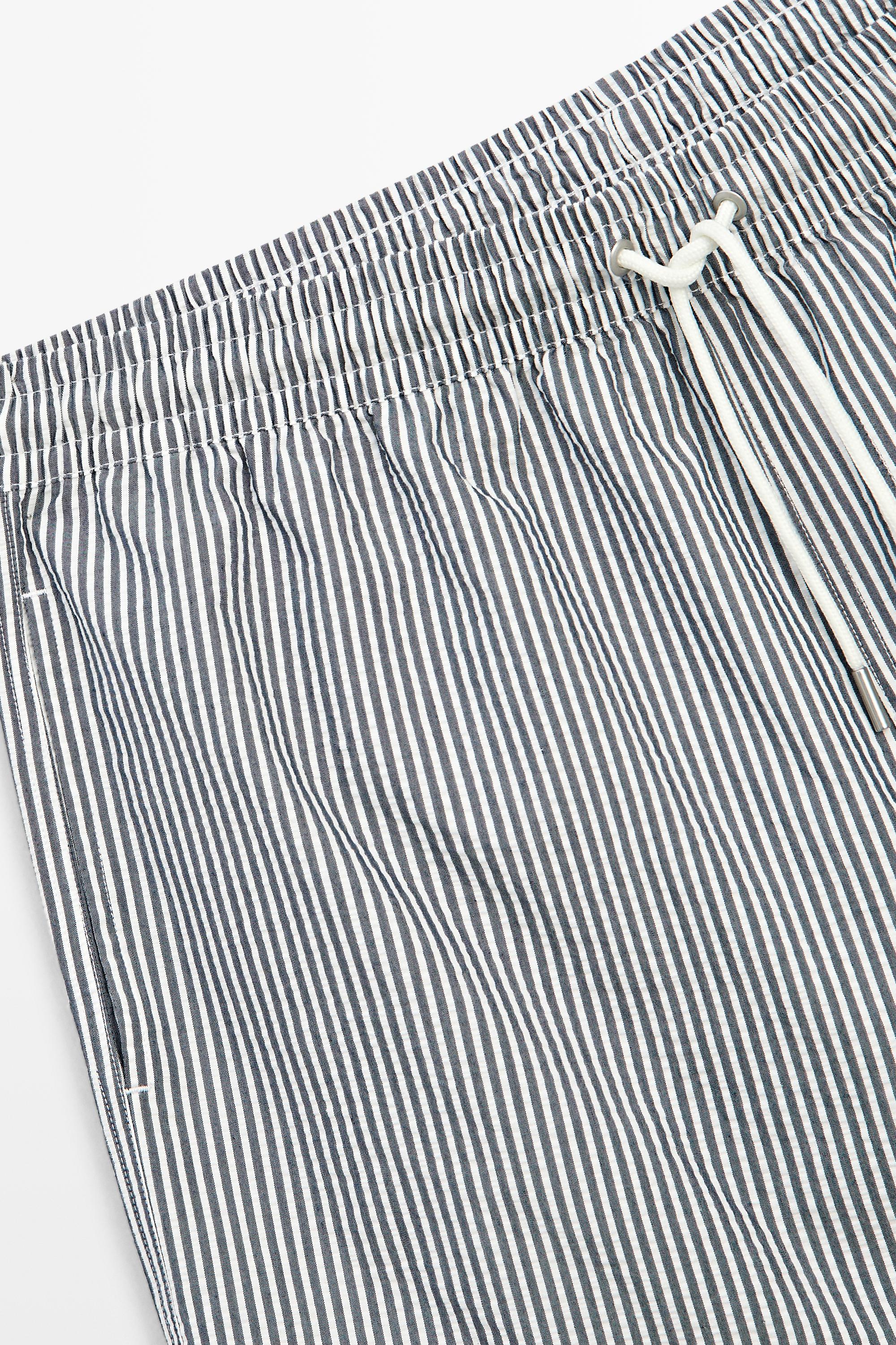 Swimming trunks with striped details — NAVY BLUE