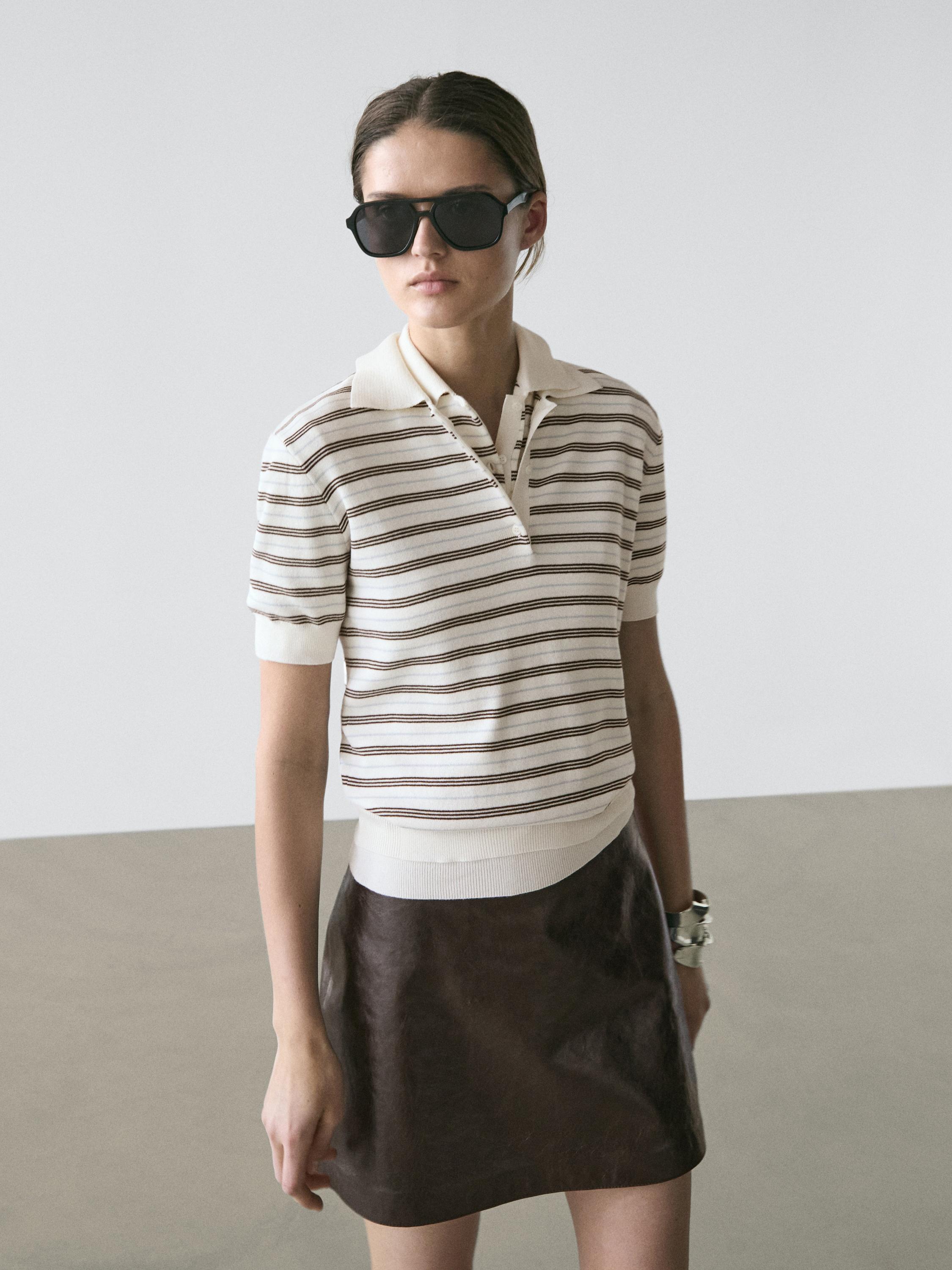 Raw short-sleeved brown striped polo set and brown skirt.