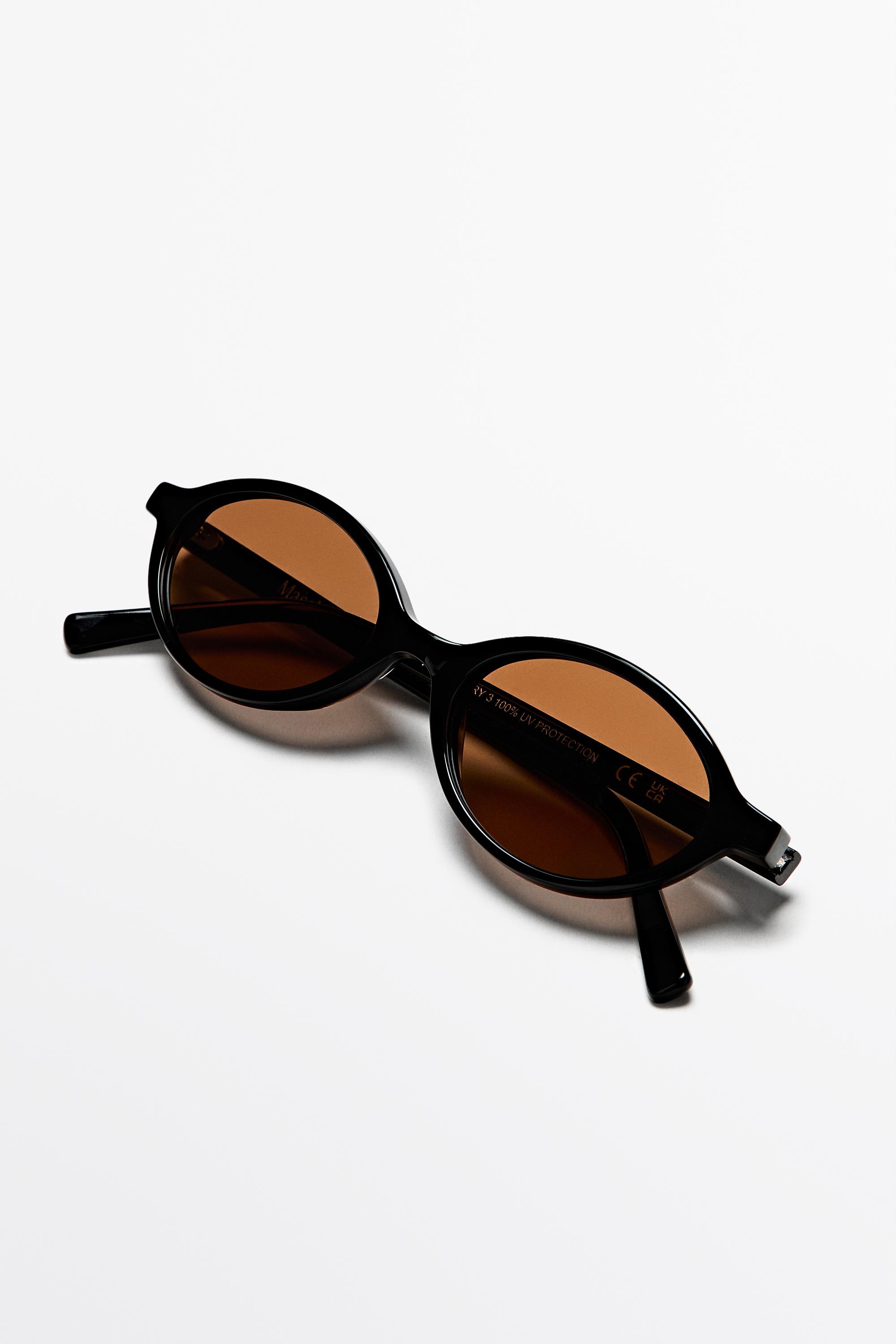 Oval sunglasses — BLACK
