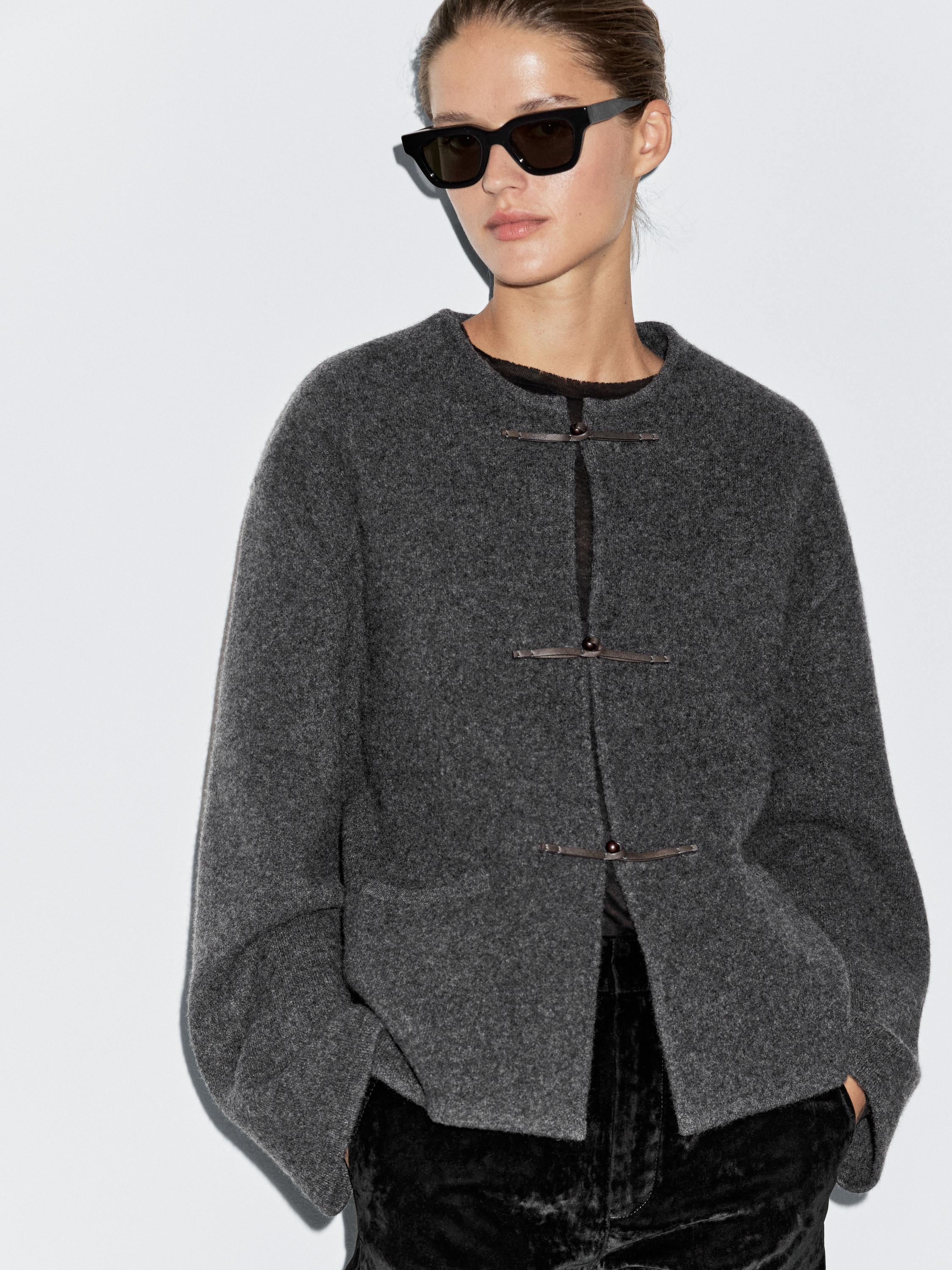 Gray cardigan set with button closure and side pockets.