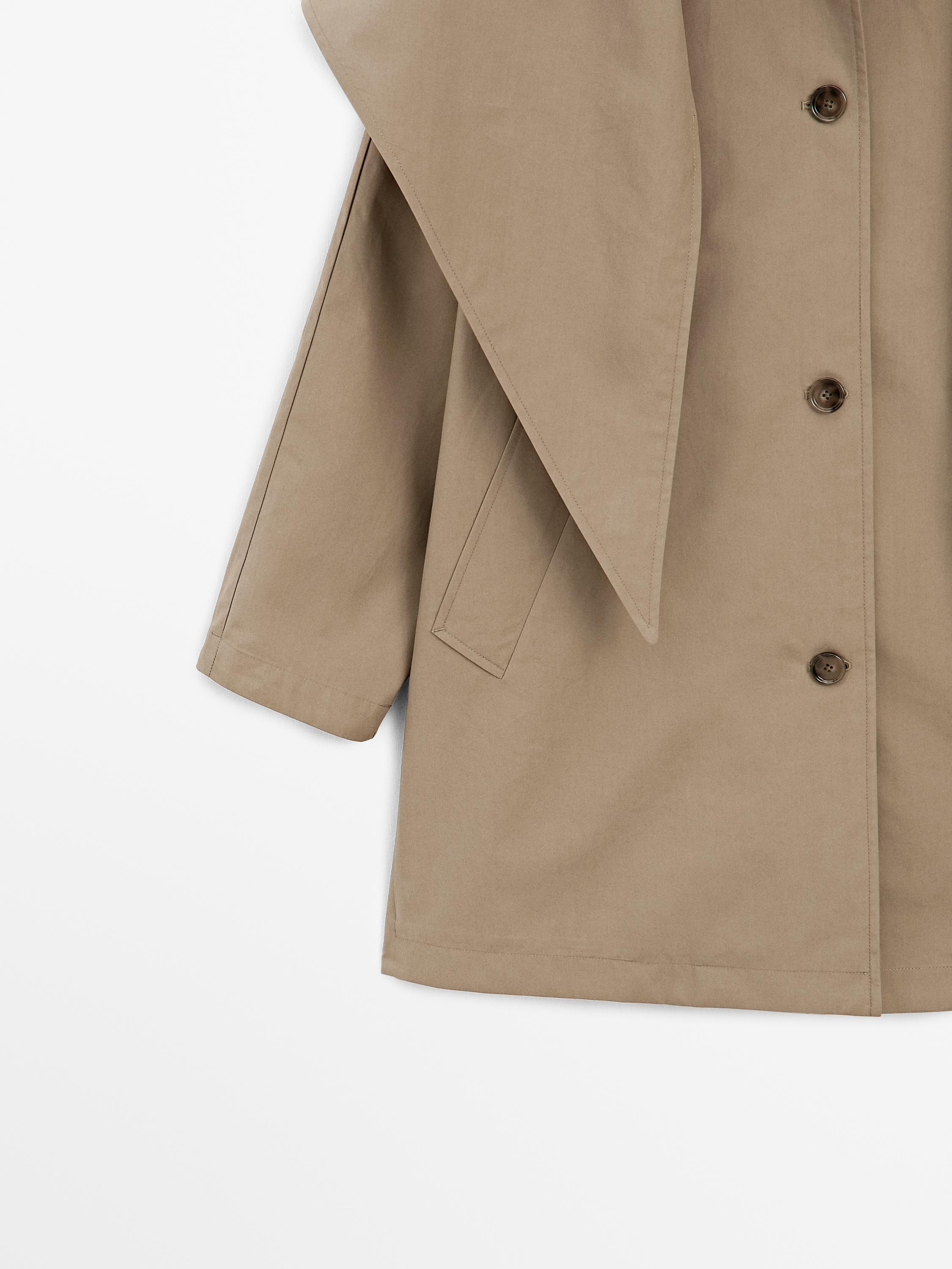 Trench coat with detachable scarf detail
