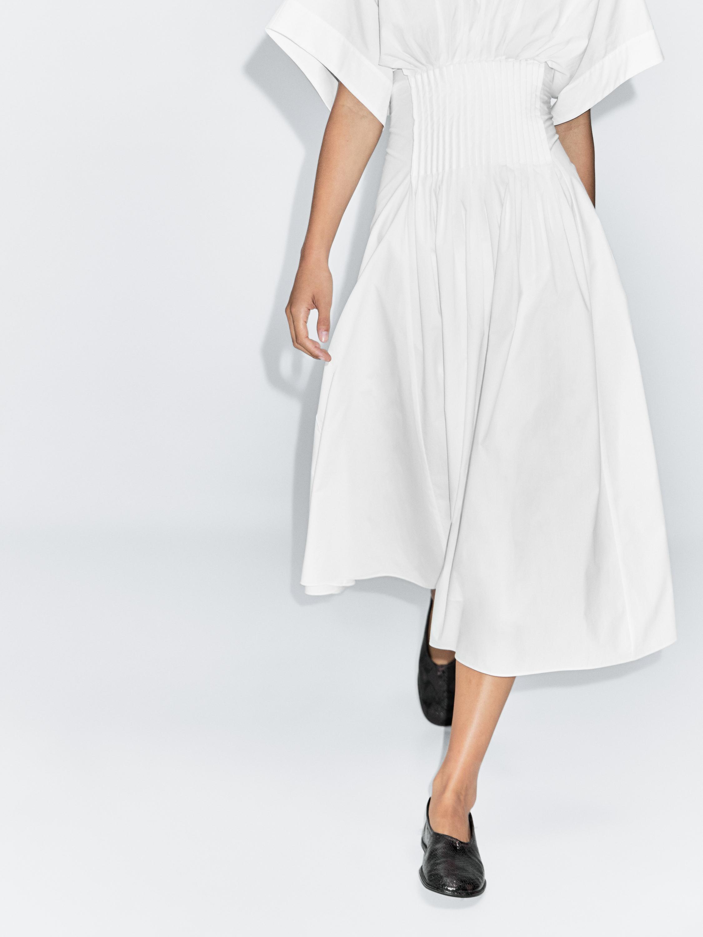 Long dress with pleated detail