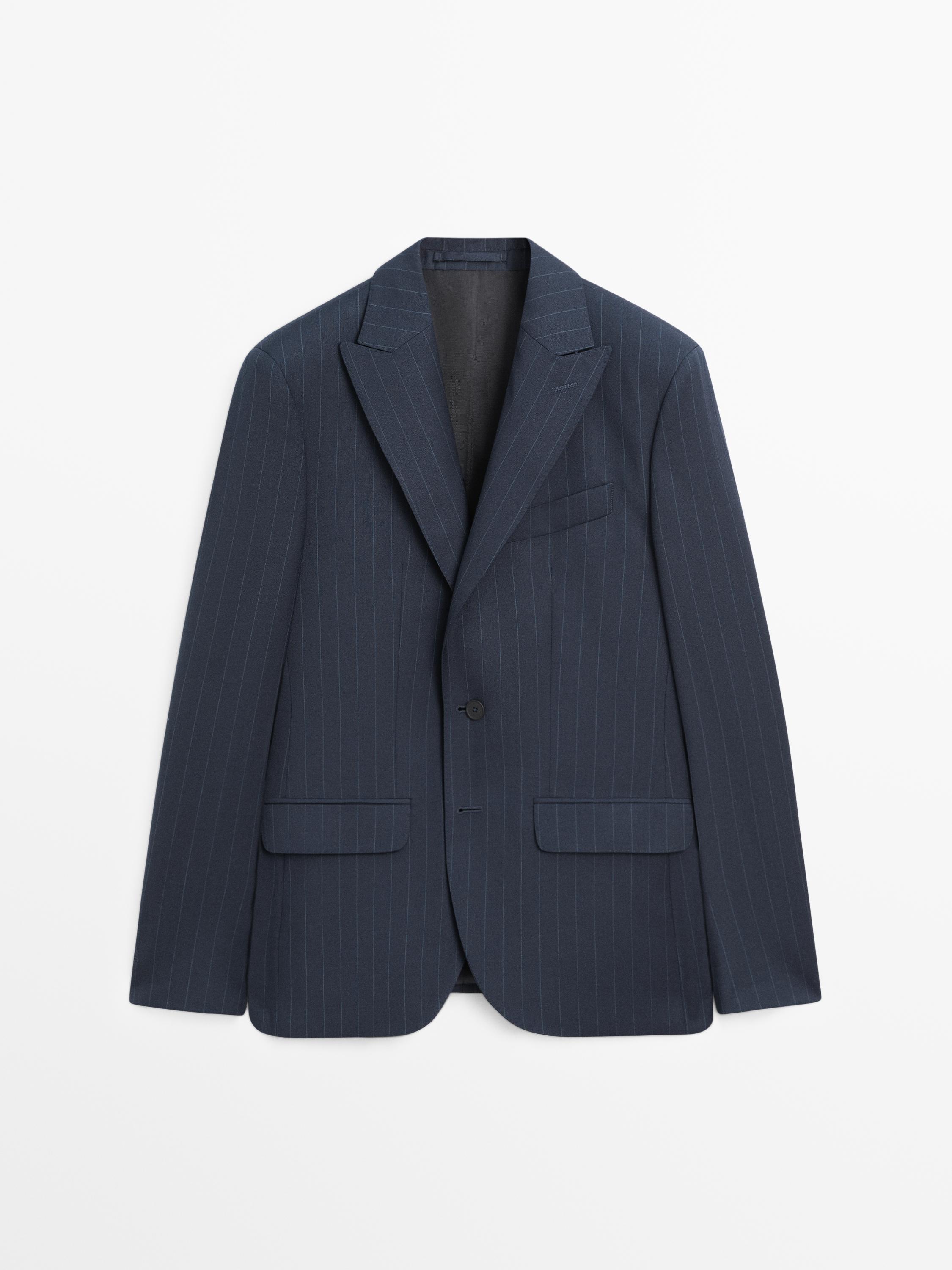 Front view of a navy blue blazer with thin stripes, classic lapels, one button, and front flap pockets.