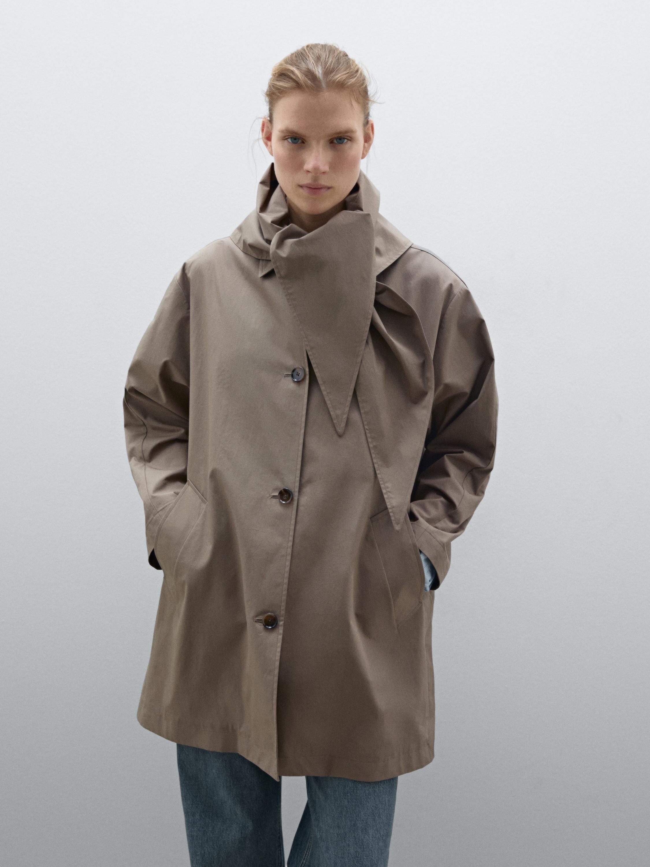 Trench coat with detachable scarf detail