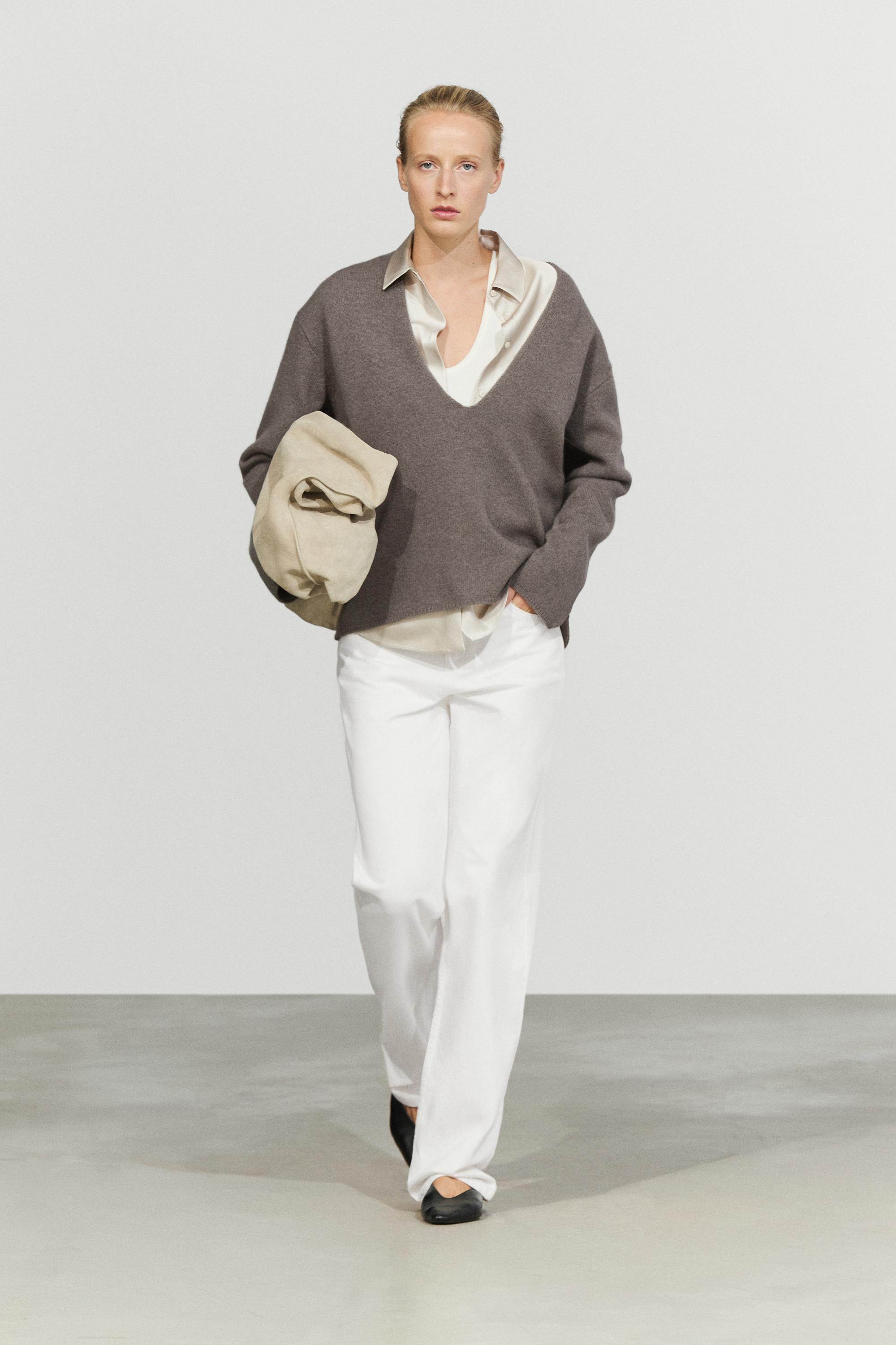 Long-line knit sweater with neckline detail