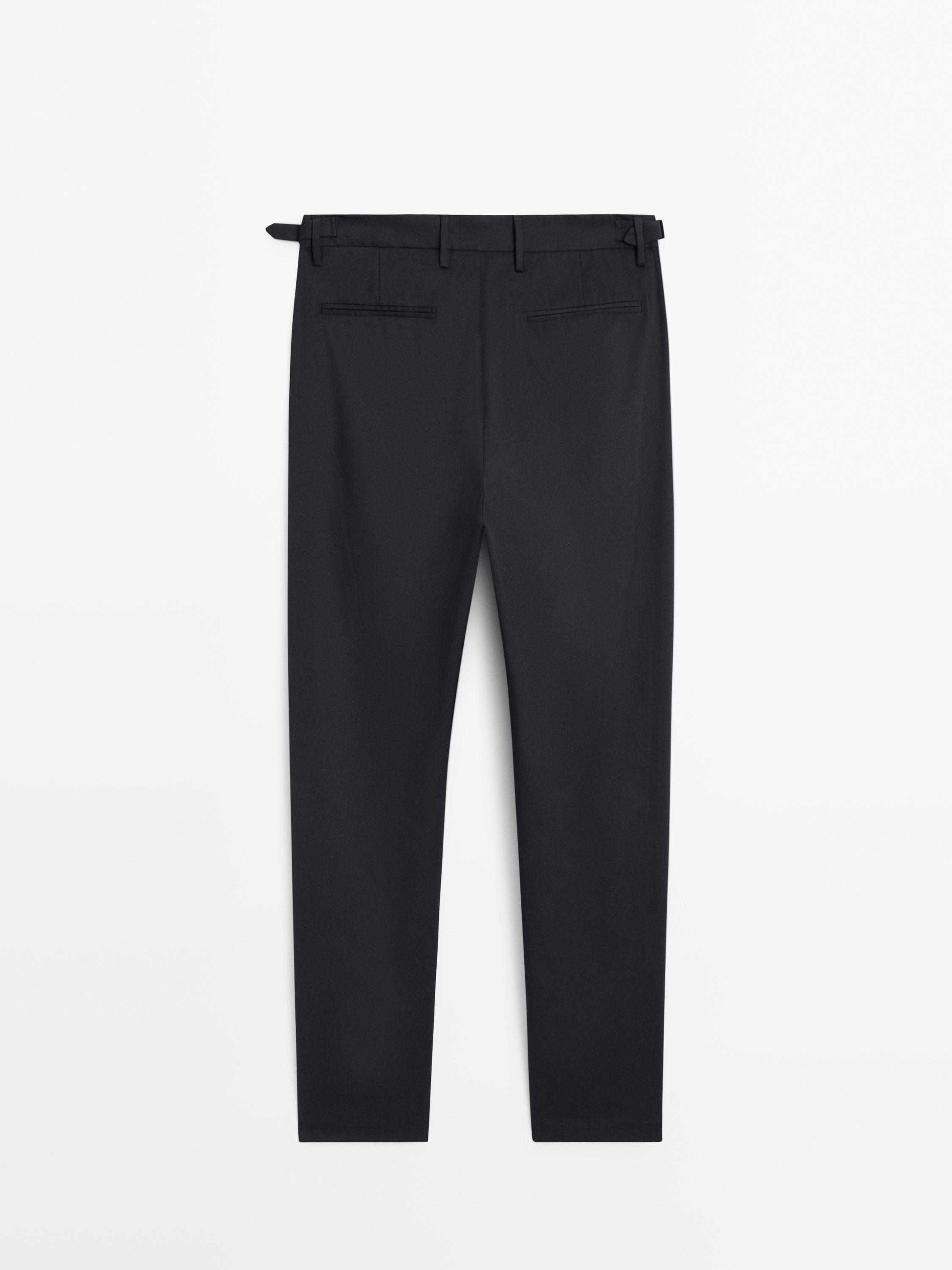Tapered fit trousers with buckle detail