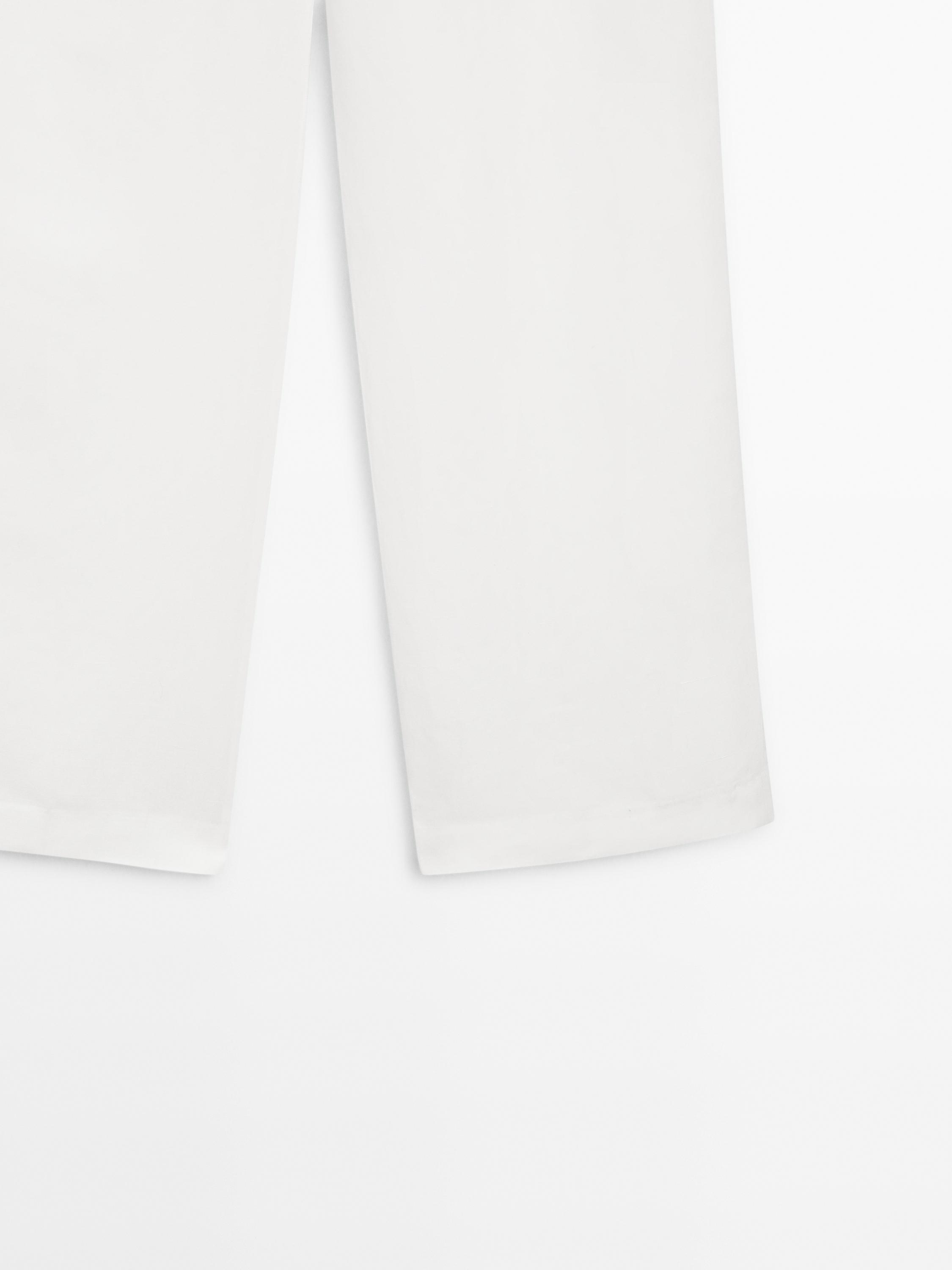 Linen blend trousers with buckle detail