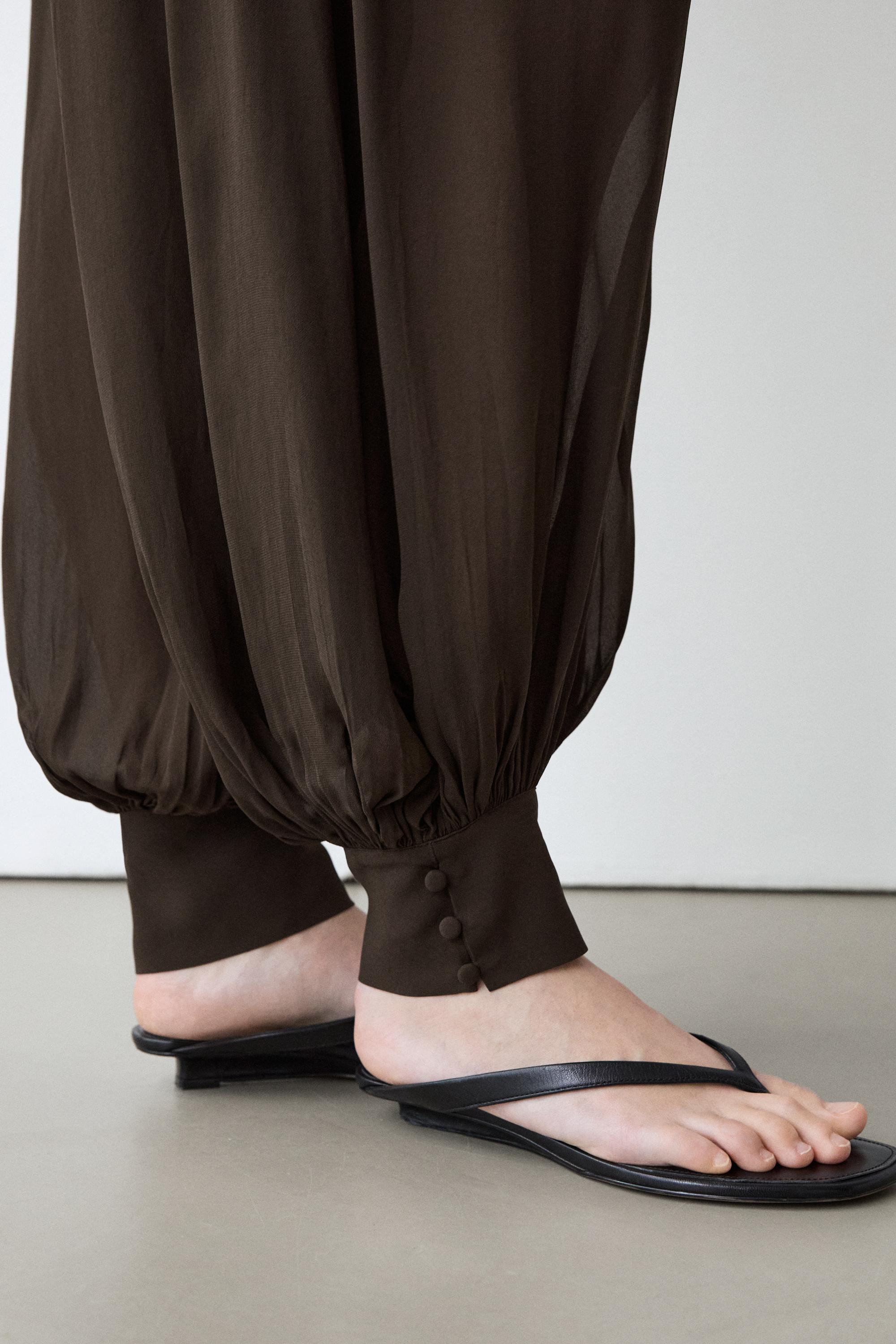 Semi-sheer sarouel trousers with button details — Chocolate