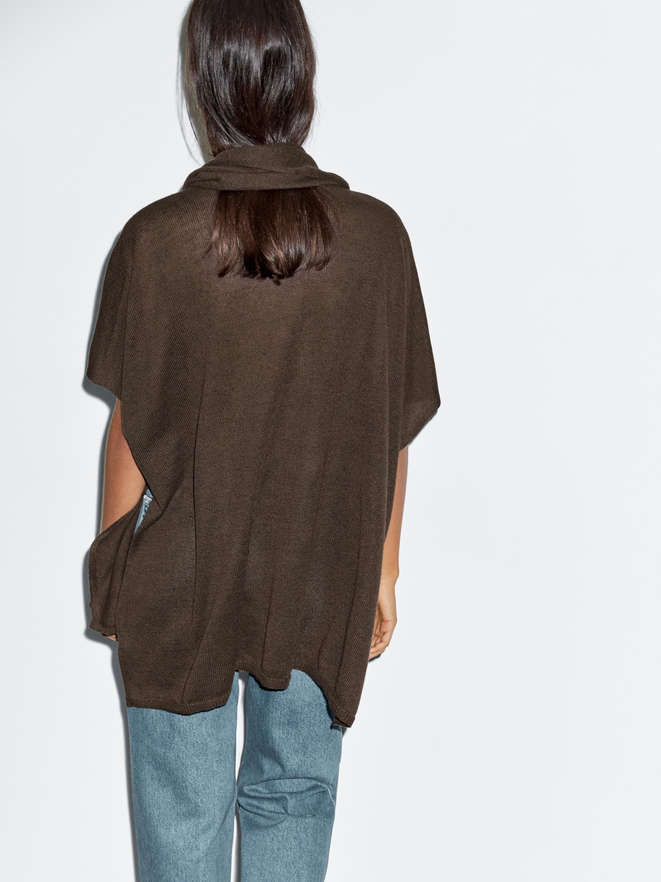 Knit cape with scarf