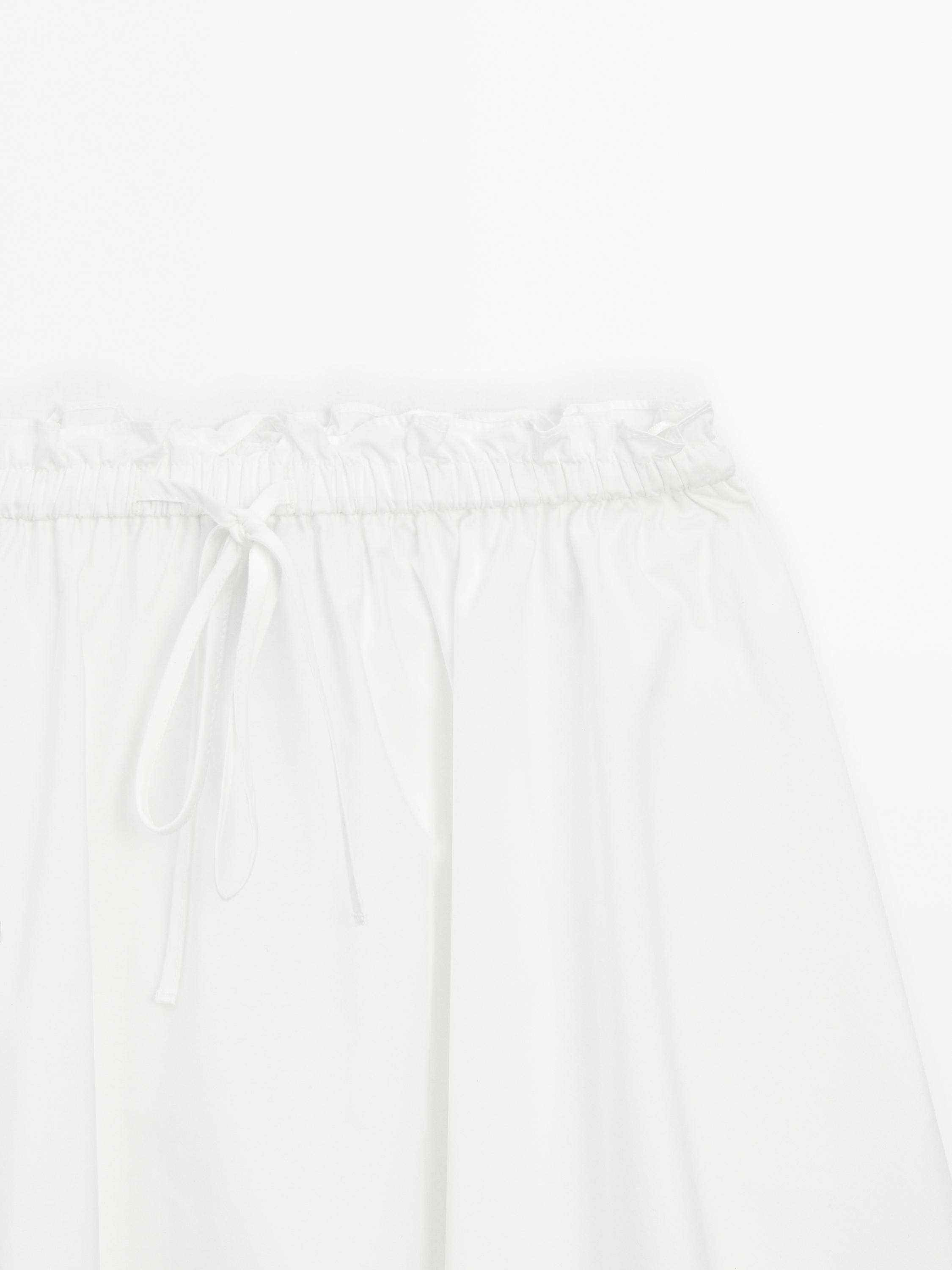 Flowing asymmetric midi skirt