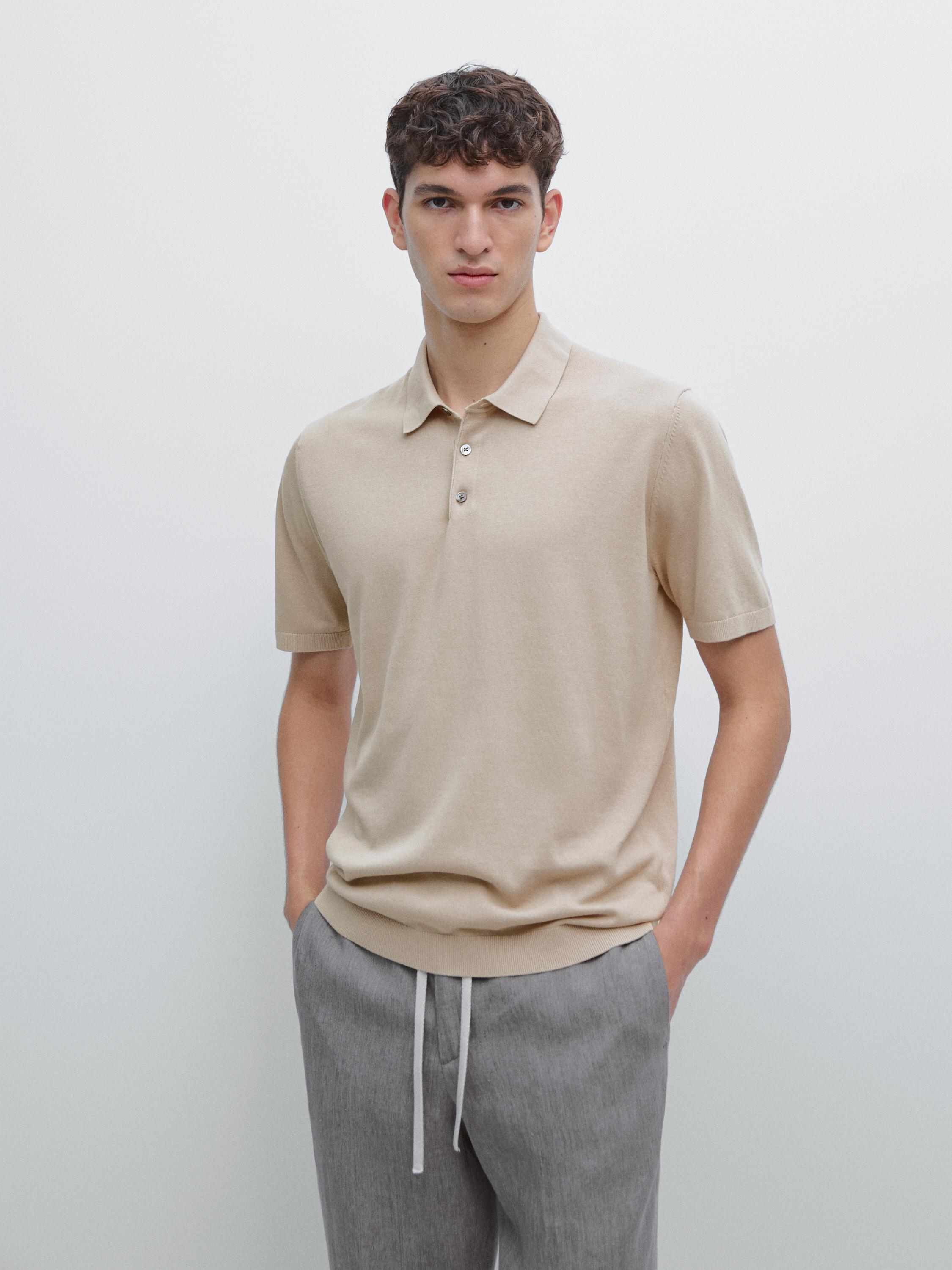 Short-sleeved beige polo set with buttons and gray pants with adjustable drawstring.