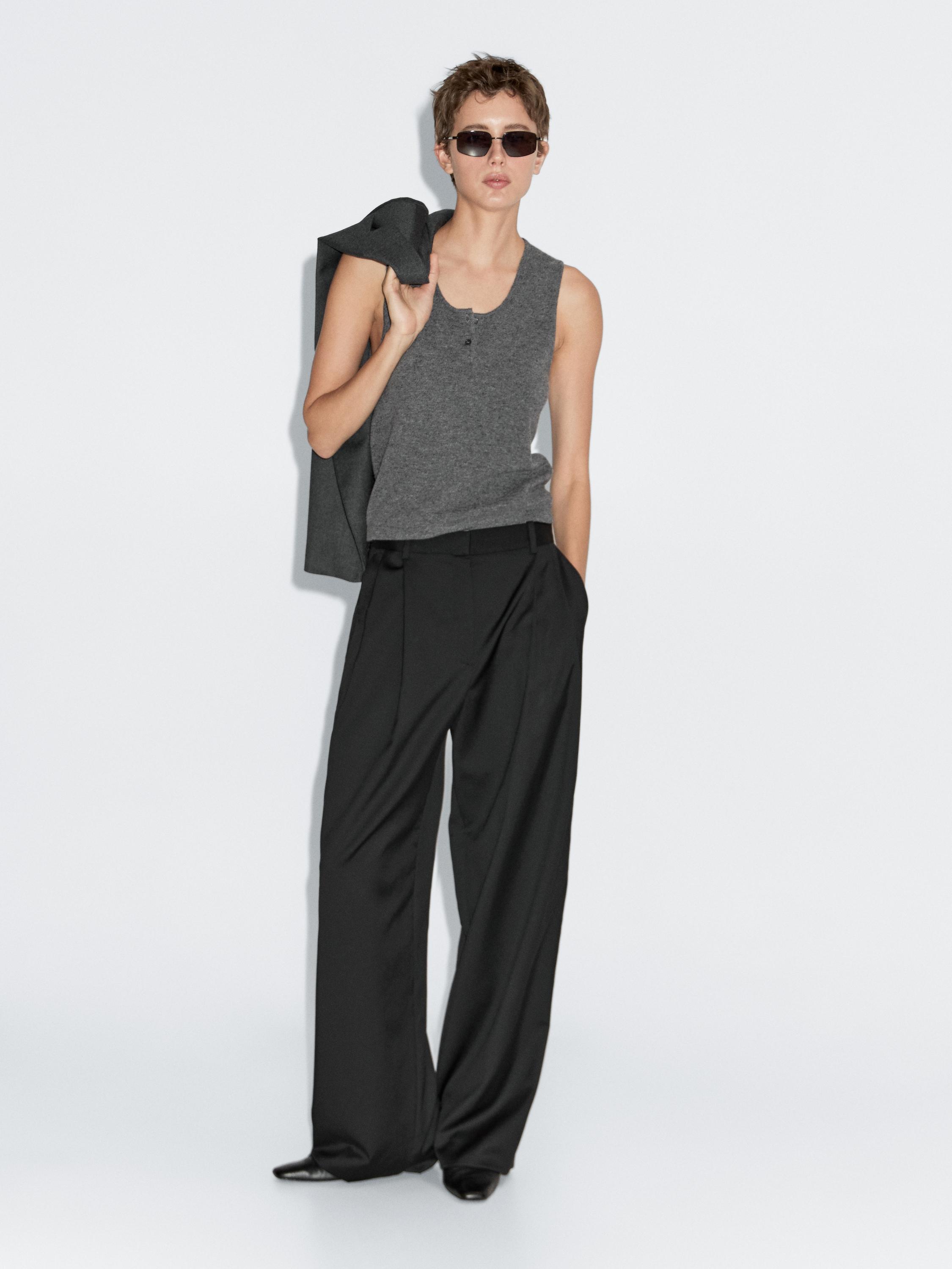 Top de malha com pormenor de botões