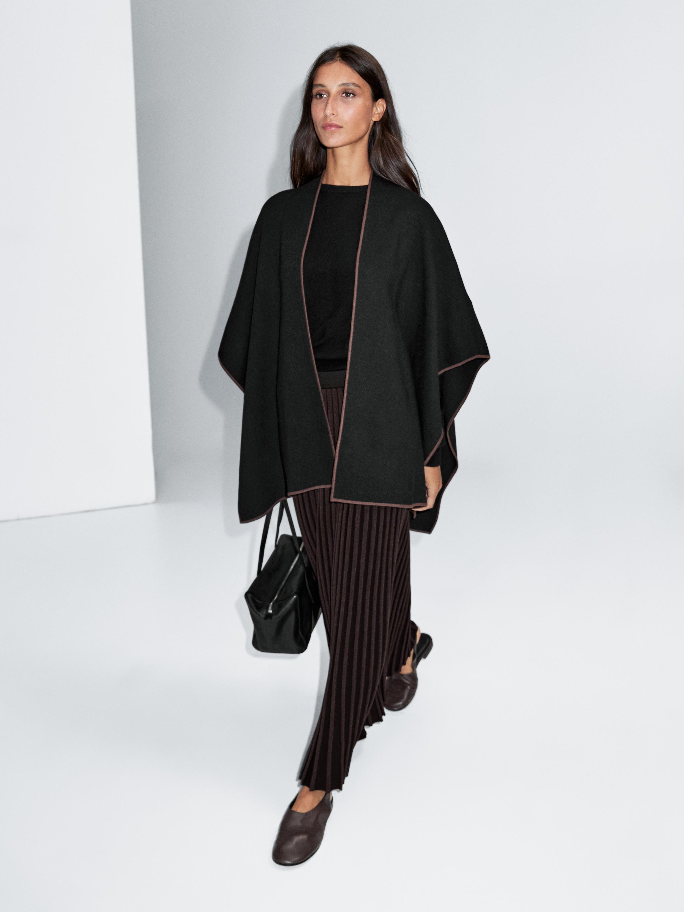 Knit cape with contrast detail