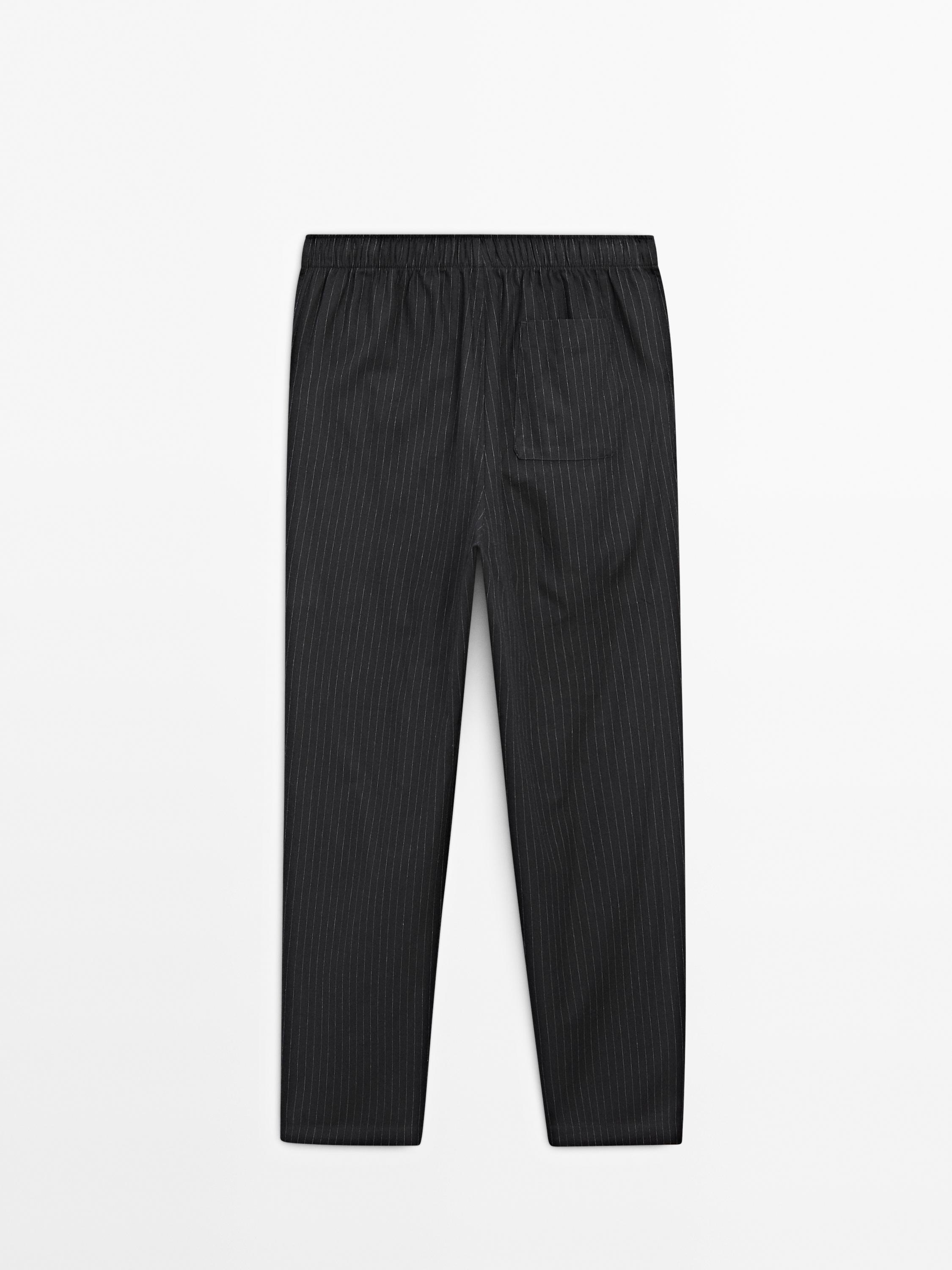 Short sleeve pyjama top and striped trousers