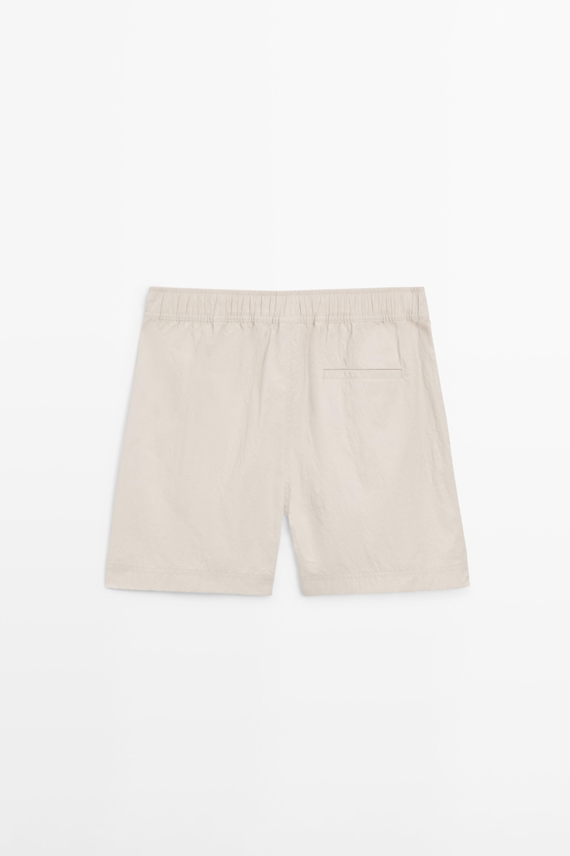 Plain swimming trunks with waist detail — SAND